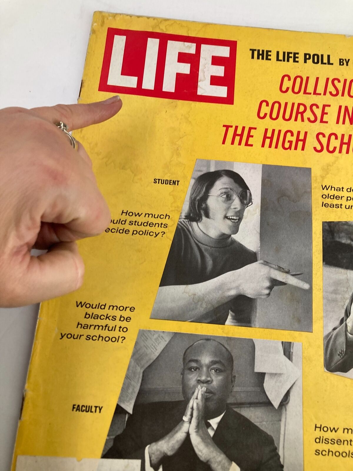 Close-up of the VTG Life Magazine May 16, 1969 cover with a hand pointing at the title 'Collision Course in The High Schools', showcasing key societal questions about education.