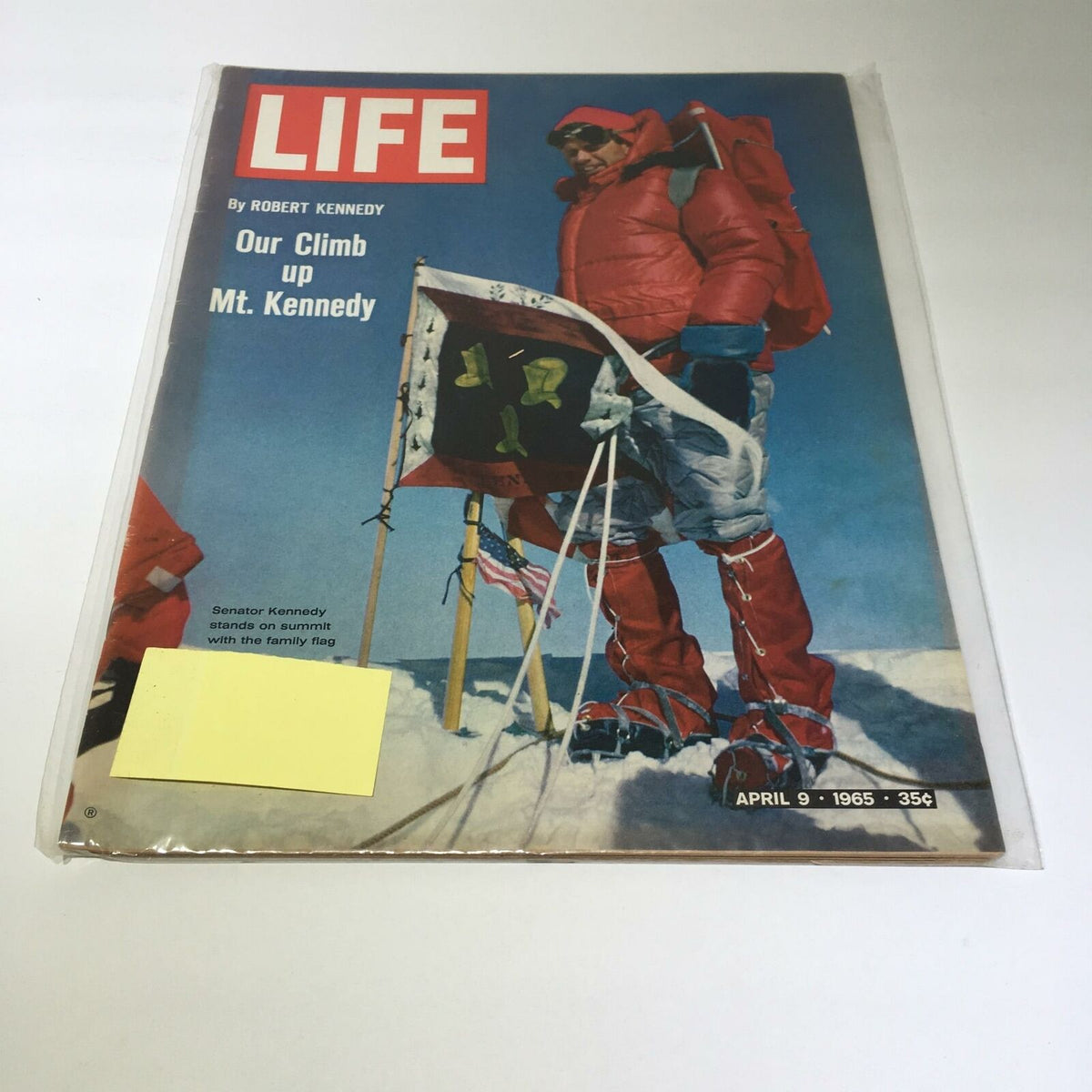 Vintage Life Magazine cover from April 9, 1965, featuring Robert Kennedy on the summit with the family flag, showcasing an iconic moment in history.