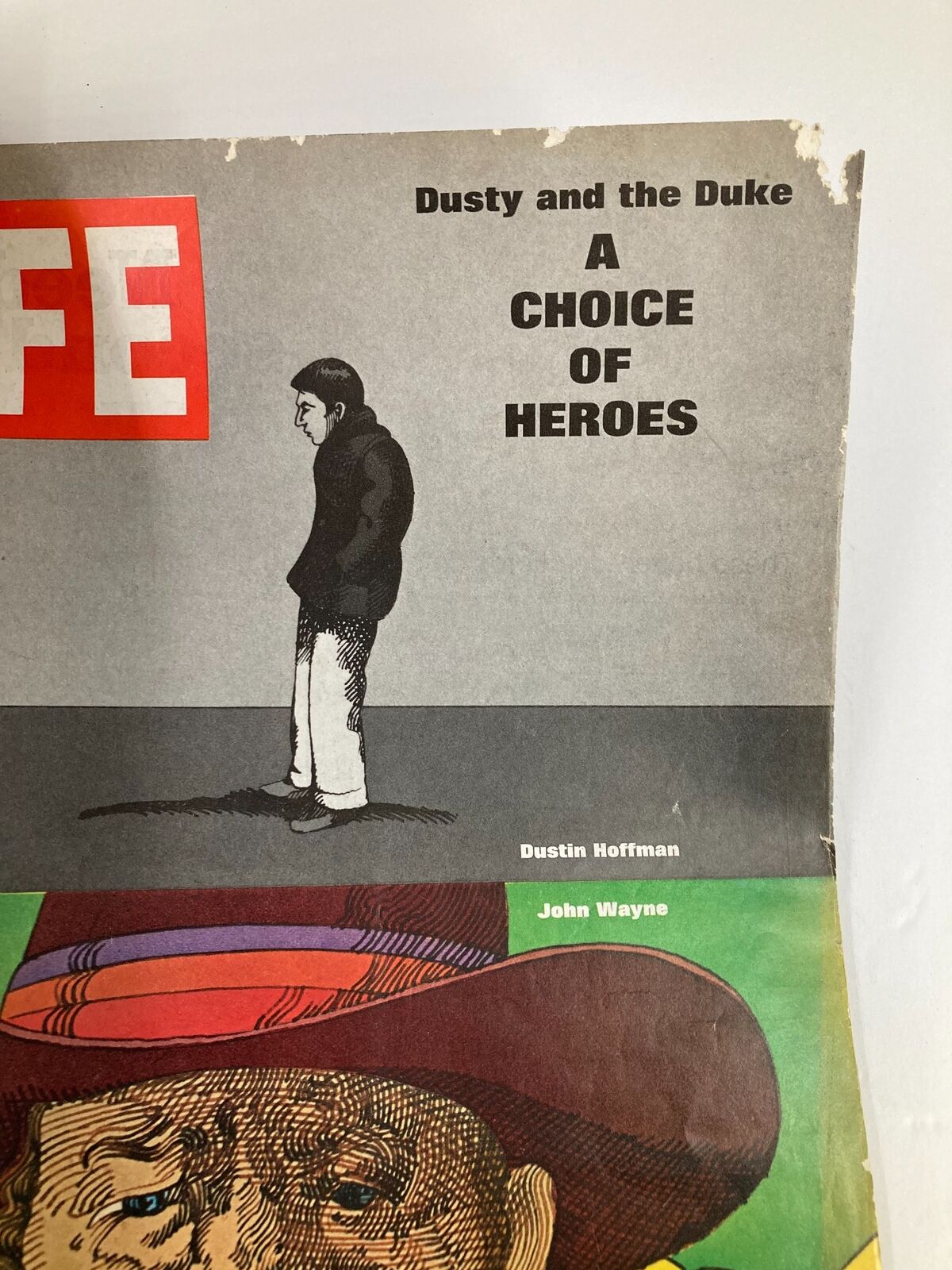 Cover of VTG Life Magazine July 11, 1969 showcasing Dustin Hoffman and a feature titled 'A Choice of Heroes' with illustrations of Dustin Hoffman and John Wayne.