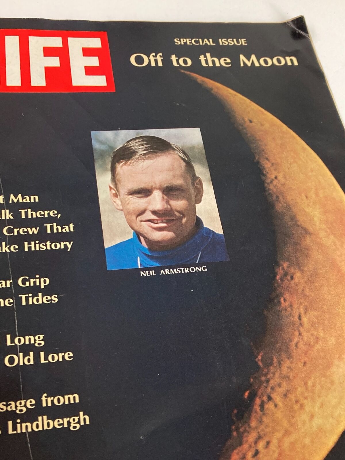 Close-up of the Vintage Life Magazine July 4, 1969 cover showcasing Neil Armstrong, first man to walk on the moon, and highlighting the iconic moon imagery.