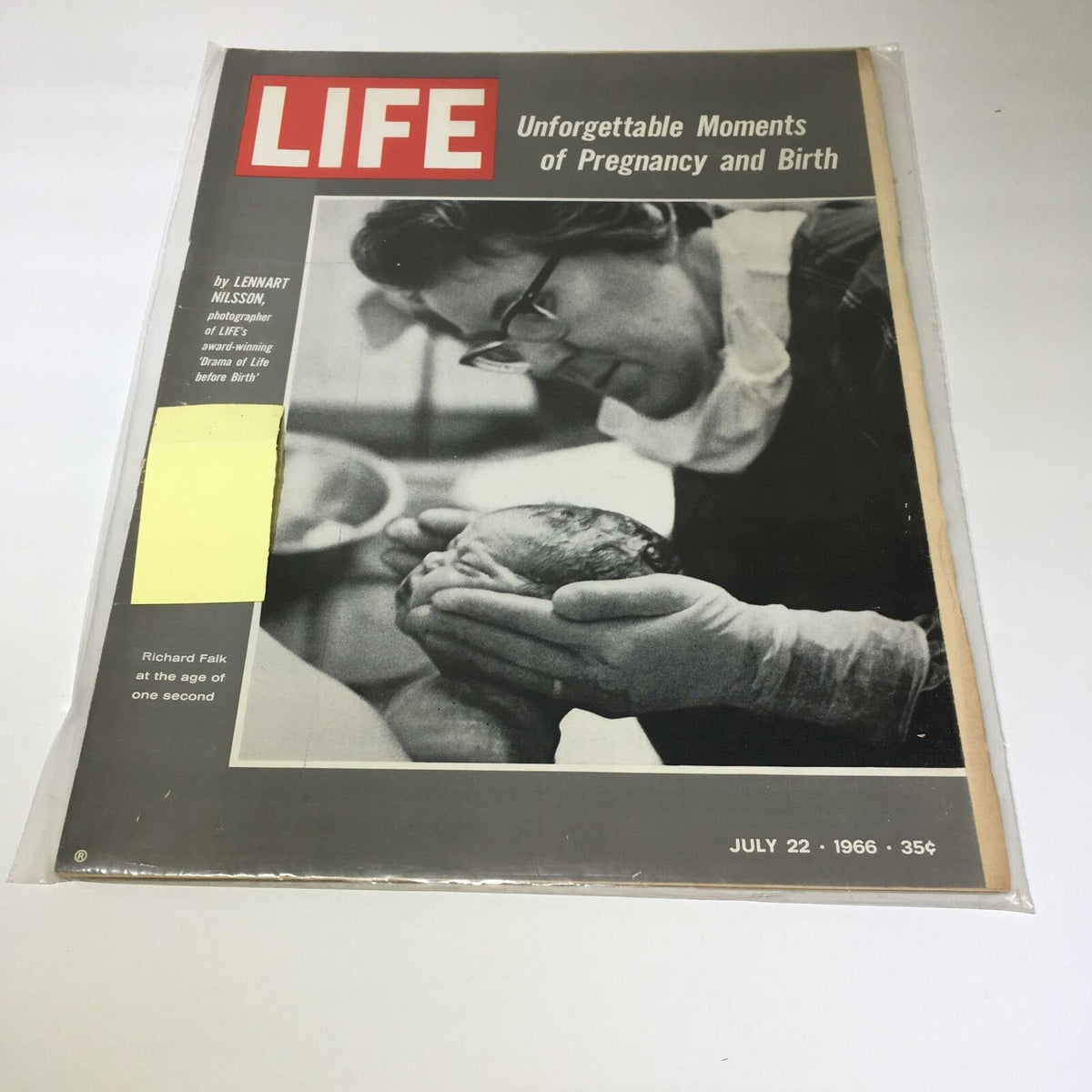Vintage Life Magazine cover from July 22, 1966 featuring Richard Falk's article on 'Unforgettable Moments of Pregnancy and Birth', showcasing a striking black and white photo of a newborn being held by a gloved medical professional.