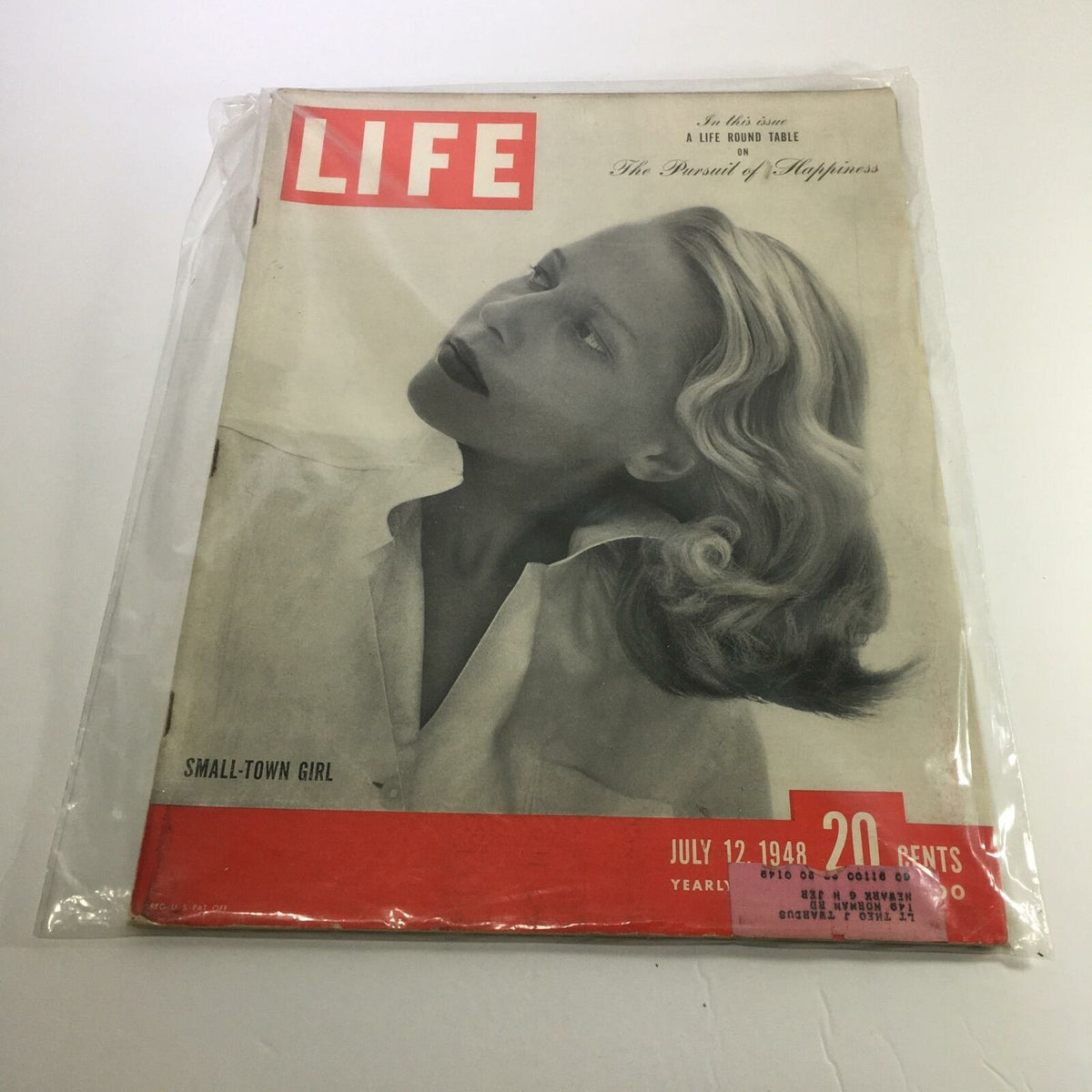 Cover of Life Magazine dated July 12, 1948, featuring Small Town Girl Pattie Nelson. The magazine showcases a vintage photograph with a woman posing elegantly, embodying the charm of the post-war era, enhanced by the iconic red and white Life logo.