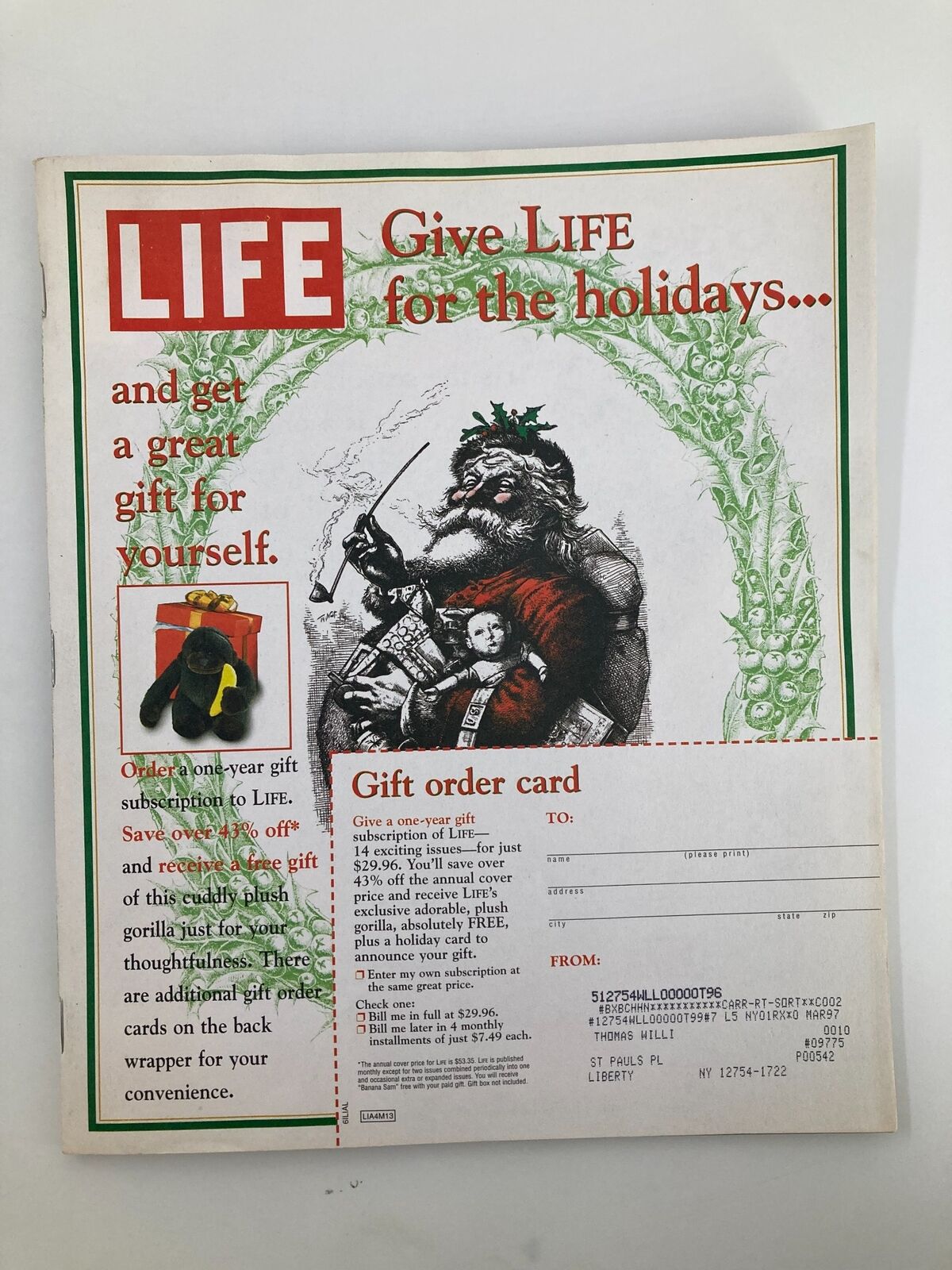 Back cover of Life Magazine November 1996 showcasing a holiday subscription offer with festive imagery and a gift order card to encourage new subscriptions.