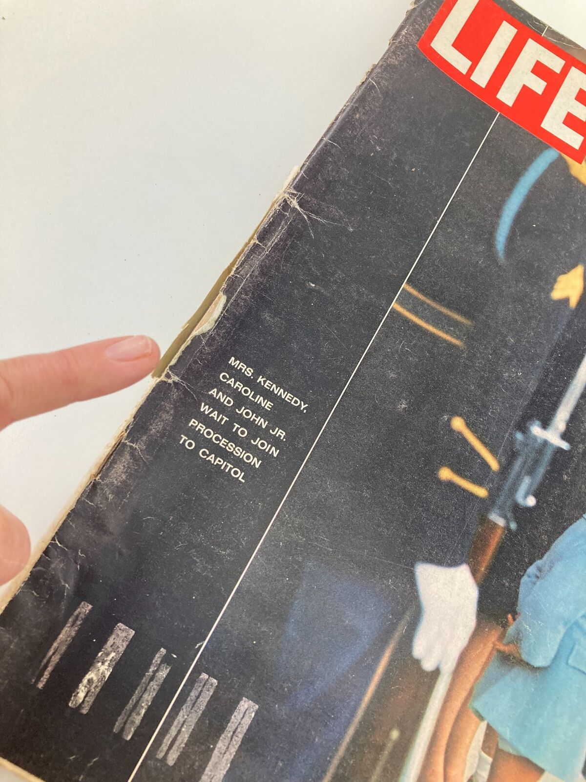 Close-up of the vintage Life Magazine cover from December 6, 1963 highlighting Mrs. Kennedy and her children, Caroline and John Jr., with visible wear and historical significance.