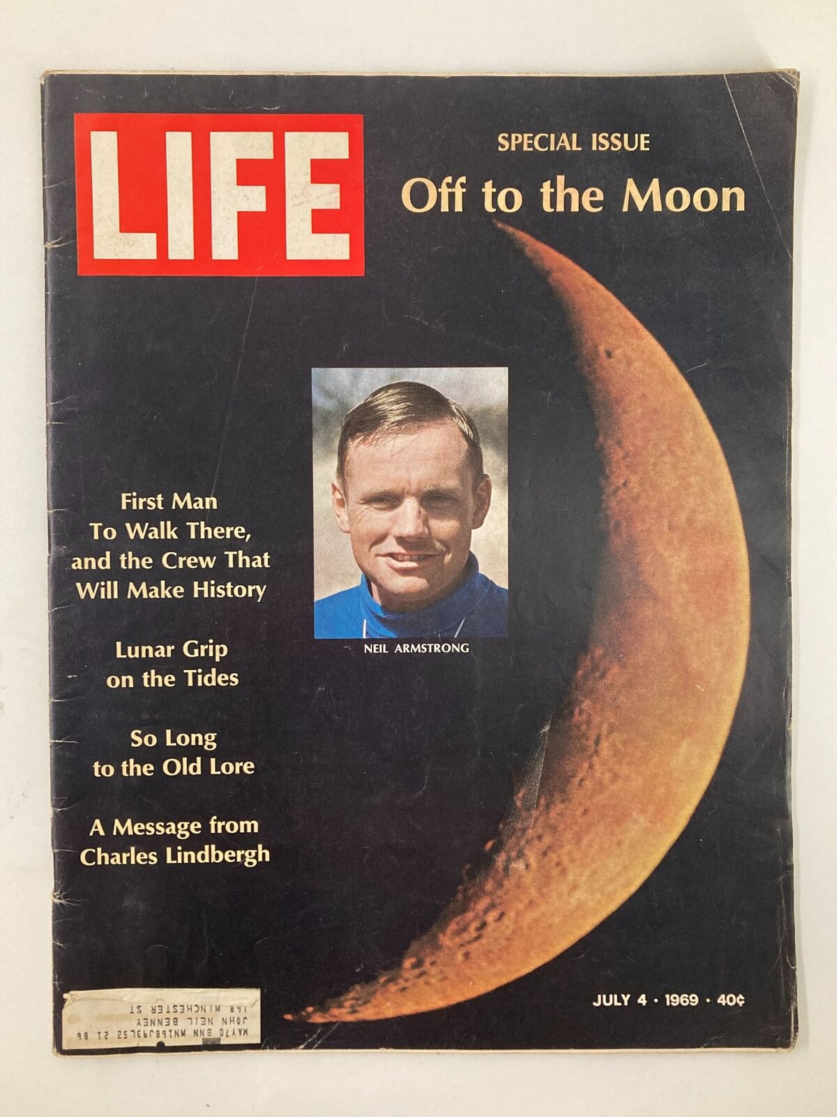 Vintage Life Magazine from July 4, 1969, featuring Neil Armstrong, the first man to walk on the moon, with a special issue titled 'Off to the Moon'. The cover showcases an iconic image of the moon and Armstrong.