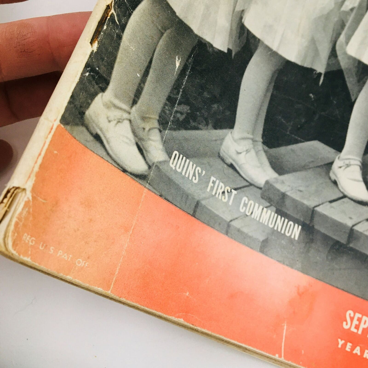 Close-up of the cover of VTG Life Magazine from September 2, 1940, featuring the text 'Quins' First Communion' and parts of the magazine's vintage design.