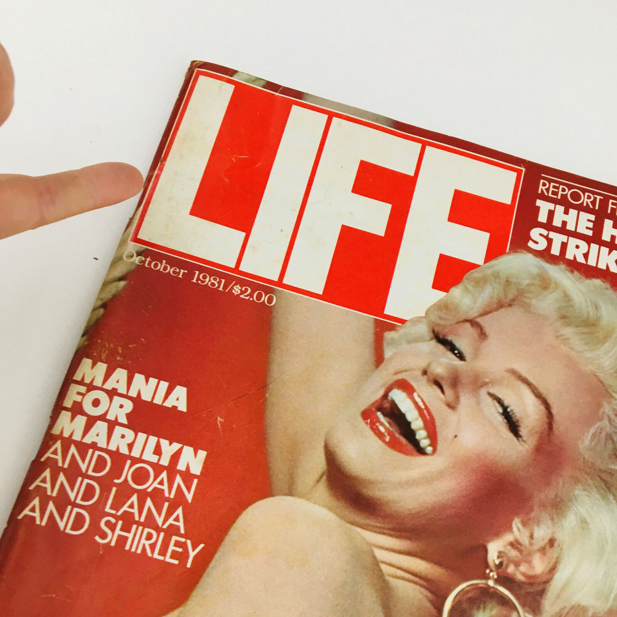 Close-up view of the cover of VTG Life Magazine October 1981, highlighting the title 'LIFE' and the feature 'Mania for Marilyn and Joan and Lana and Shirley' with Marilyn Monroe's smiling face.