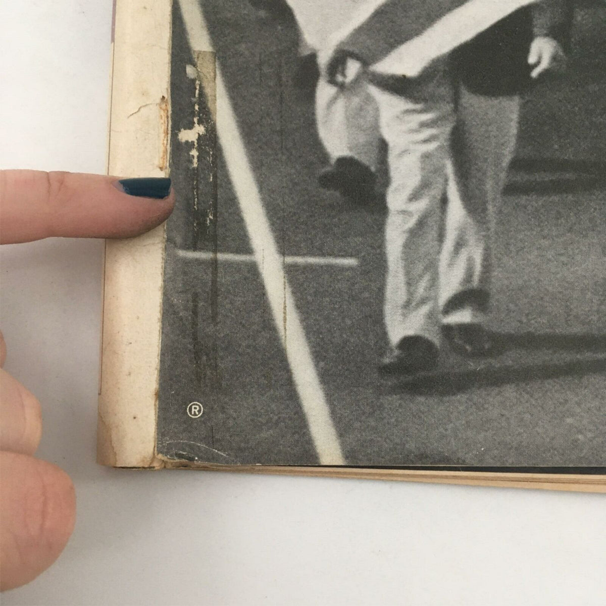 Close-up view of the edge of the September 15, 1972 Life Magazine, showcasing minor wear and imperfections, relevant to the 'Olympic Tragedy' issue about the Israeli team's loss.