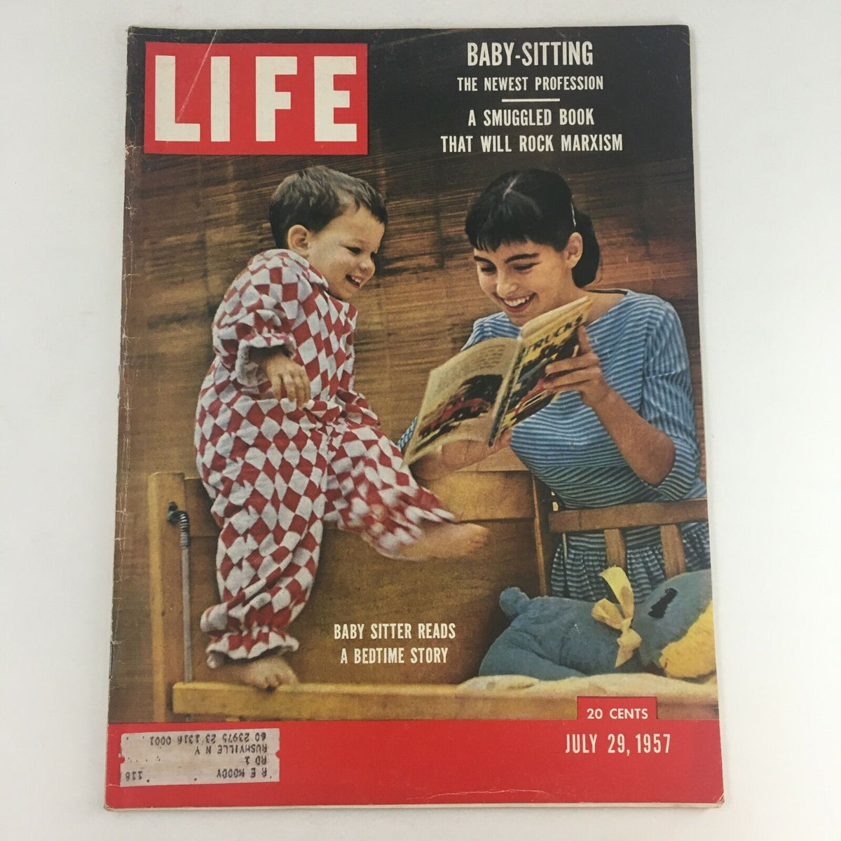 Cover image of Life Magazine dated July 29, 1957 showcasing a baby sitter reading a bedtime story to a child, highlighting 'Baby Sitter Reads A Bedtime Story, The New Profession'.