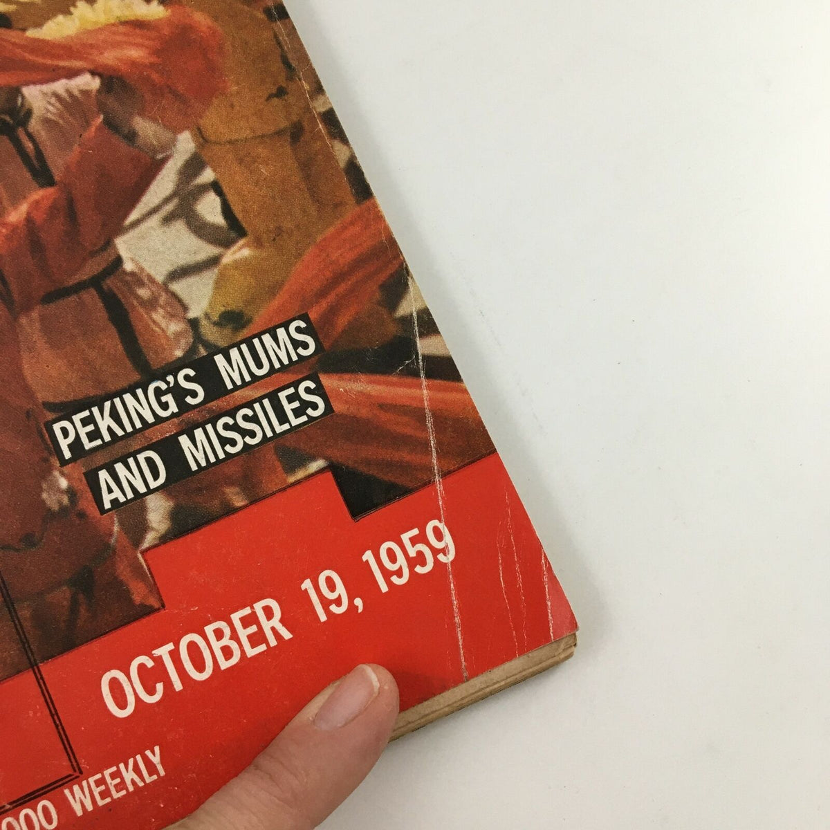 Corner detail of VTG Life Magazine dated October 19, 1959, displaying 'Peking's Mums and Missiles' title and the publication date, with visible wear and creases on the cover.