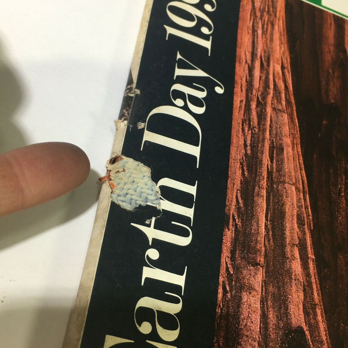Close-up of the spine of VTG Life Magazine May 1990, showing wear and minor damage. The title 'Earth Day 1990' is partially visible, emphasizing the magazine's environmental focus.