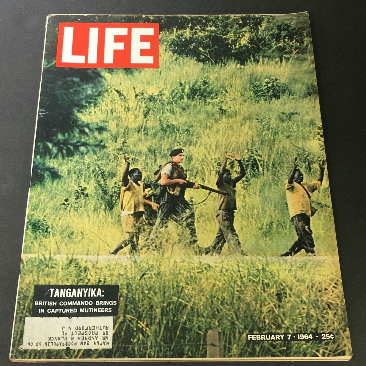 Cover of VTG Life Magazine February 7 1964 featuring a British Commando with captured mutineers in Tanganyika, highlighting a significant historical moment.