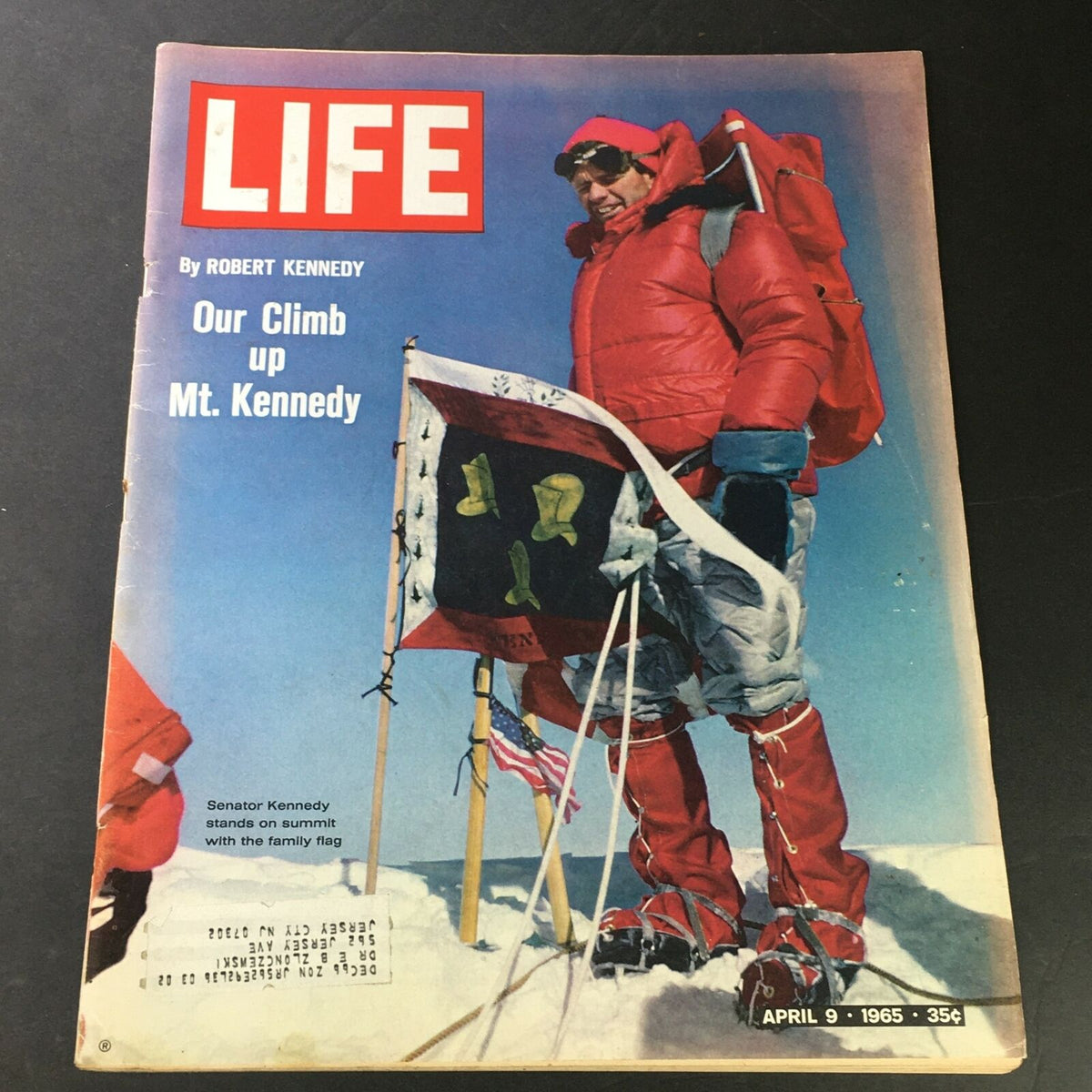 Cover of Life Magazine April 9 1965 featuring Robert Kennedy's climb at Mt. Kennedy, showcasing the iconic red jacket and summit flags.