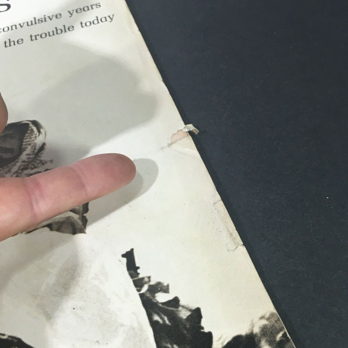 Detail of the edge of a vintage Life Magazine from October 6, 1967, featuring minor wear and a small tear, showcasing the nostalgia of 'A Sentimental Journey of the Queen Mary'.