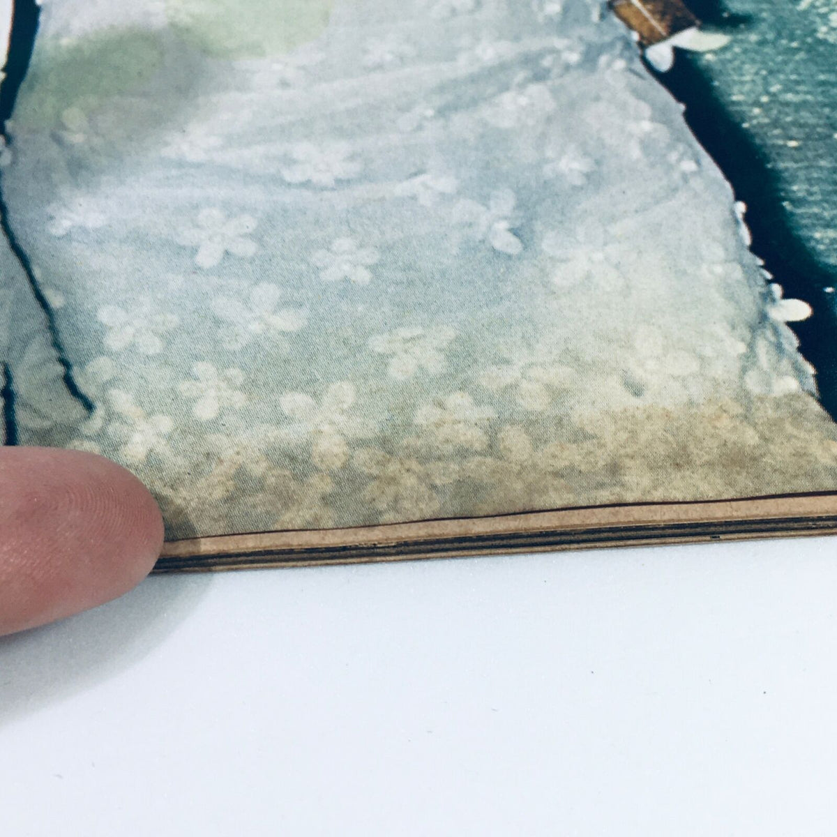 Detailed image of the bottom edge of a vintage Life Magazine featuring Rose Kennedy at 80, highlighting minor wear and the unique character of the magazine.