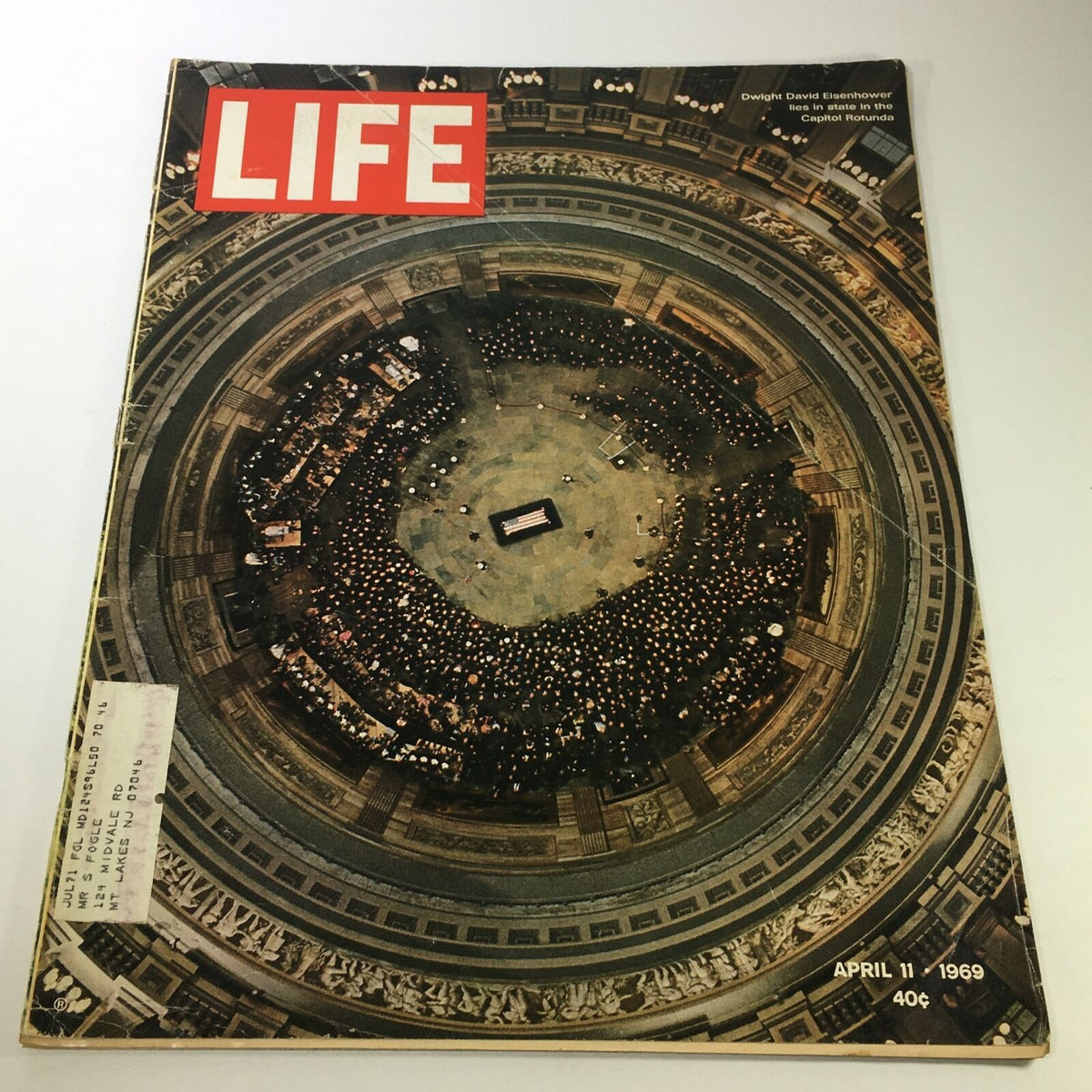 Vintage Life Magazine cover from April 11, 1969, featuring a solemn aerial view of Dwight David Eisenhower's funeral service, showcasing attendees in the Capitol Rotunda.
