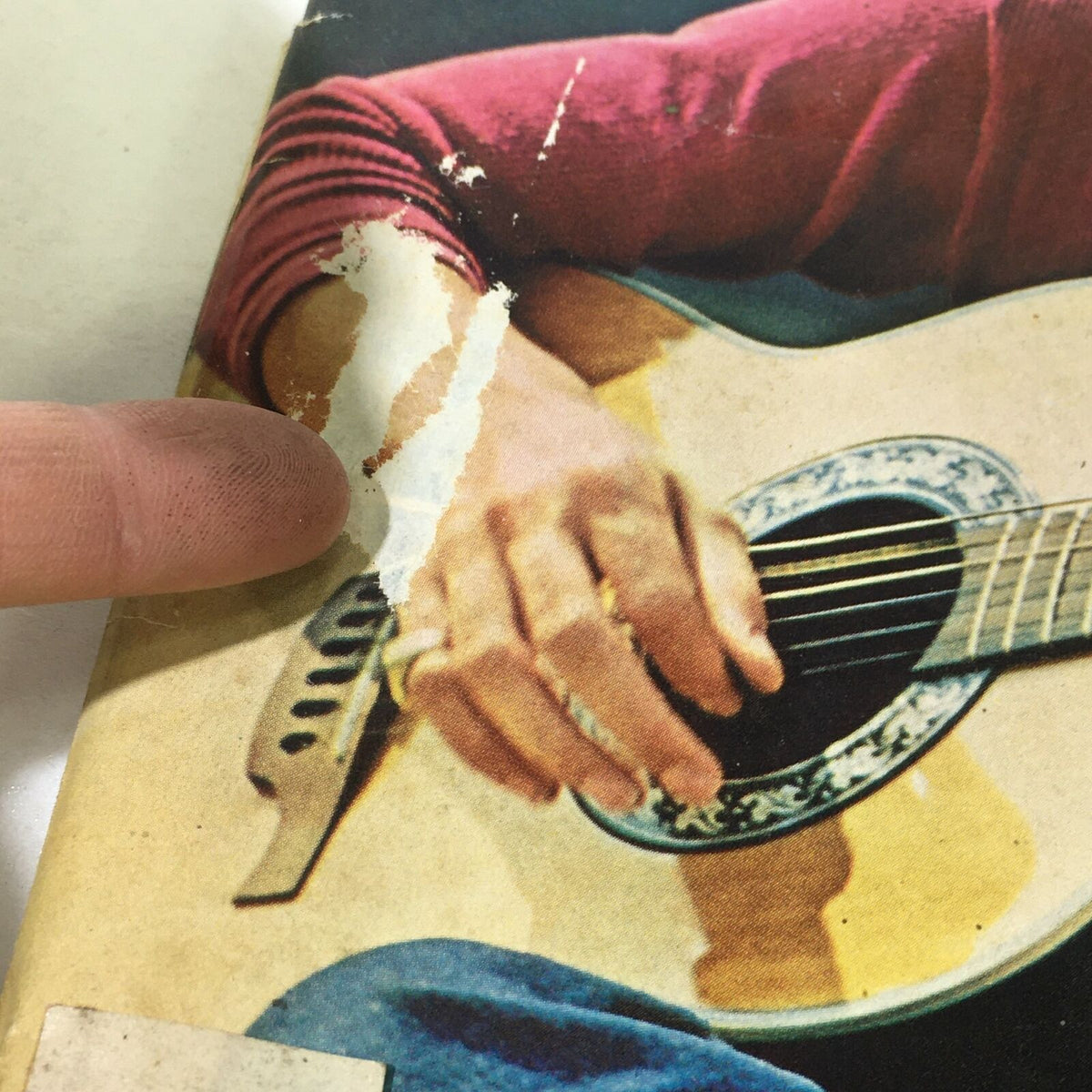 Close-up of VTG Life Magazine showing wear, focusing on David Cassidy's hand on his guitar and damage to the magazine cover.
