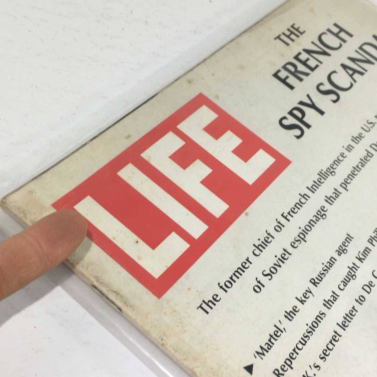 Close-up view of the cover of VTG Life Magazine: April 26 1968 featuring the title 'The French Spy Scandal' highlighting its historical narrative on French Intelligence.