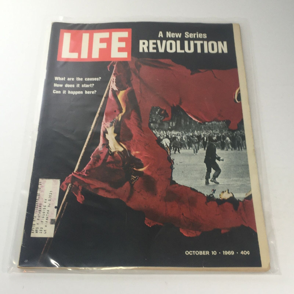 Cover of VTG Life Magazine: October 10, 1969 featuring the title 'A New Series: Revolution' with a dramatic image of a torn flag and scenes of protest, highlighting themes of social change and historical significance.