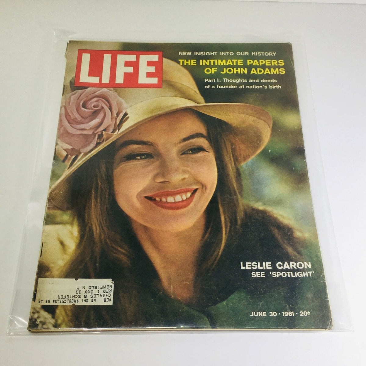 Vintage Life Magazine from June 30, 1961 featuring the captivating cover story 'The Intimate Papers of John Adams' with Leslie Caron on the cover, highlighting her radiant smile and stylish hat.
