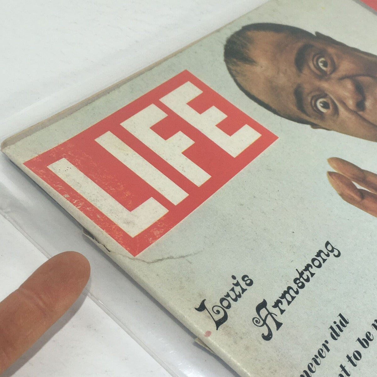 Side view of the VTG Life Magazine cover from April 15, 1966 with Louis Armstrong, displaying minor bends and the classic LIFE magazine logo.