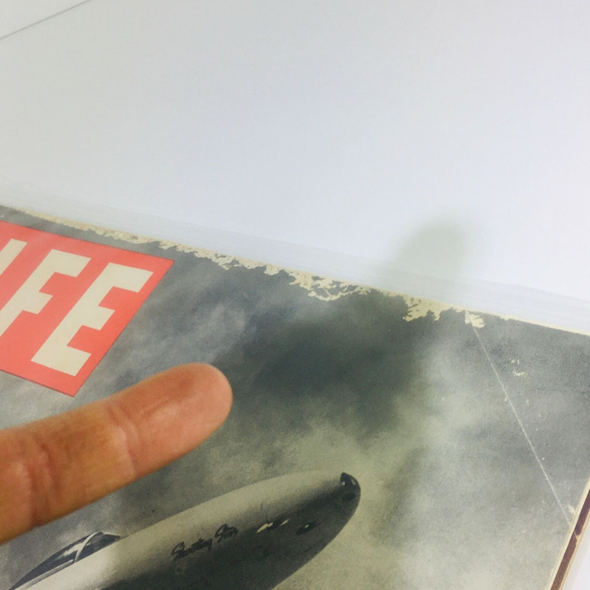 Close-up of the top edge of the Life magazine from August 13, 1945, with visible wear and the iconic Life logo and jet plane imagery.