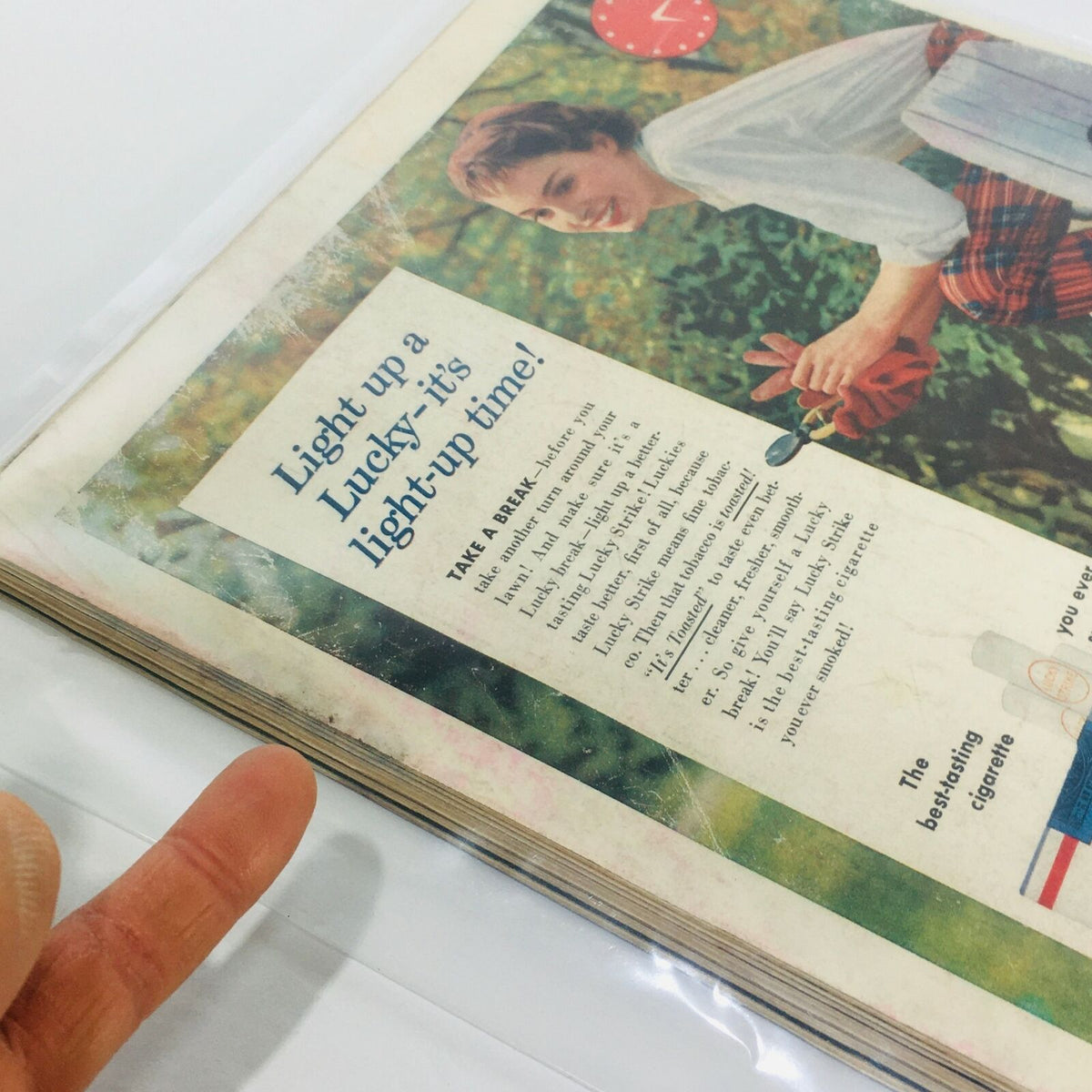 Interior page from VTG Life Magazine dated September 26, 1955, showcasing an advertisement with a woman holding flowers and text promoting Lucky cigarettes.