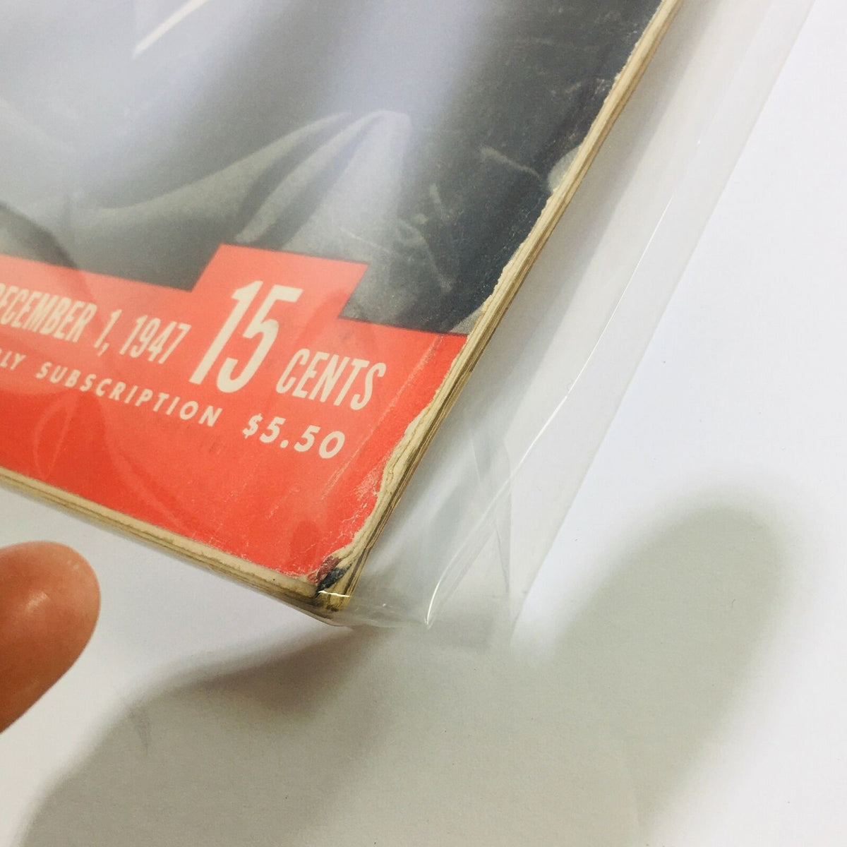 Detail of VTG Life Magazine cover from December 1, 1947, showing wear at the edges and protective plastic covering.