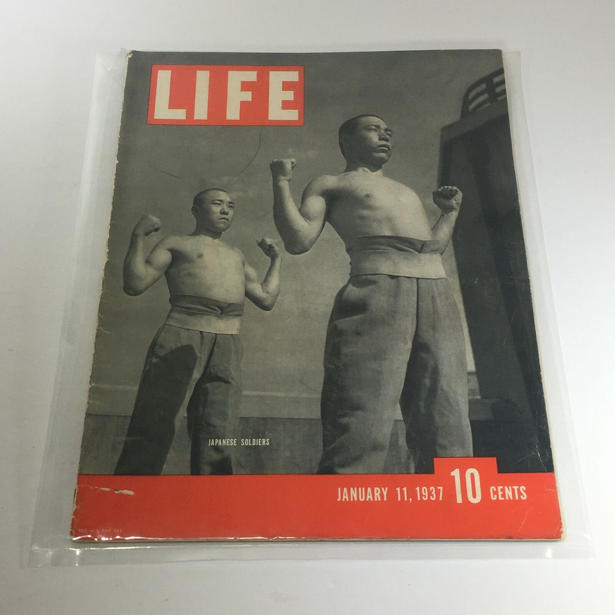 Cover of Vintage Life Magazine: January 11, 1937 featuring Japanese soldiers, showcasing a historical snapshot with two strong figures and distinctive magazine branding.