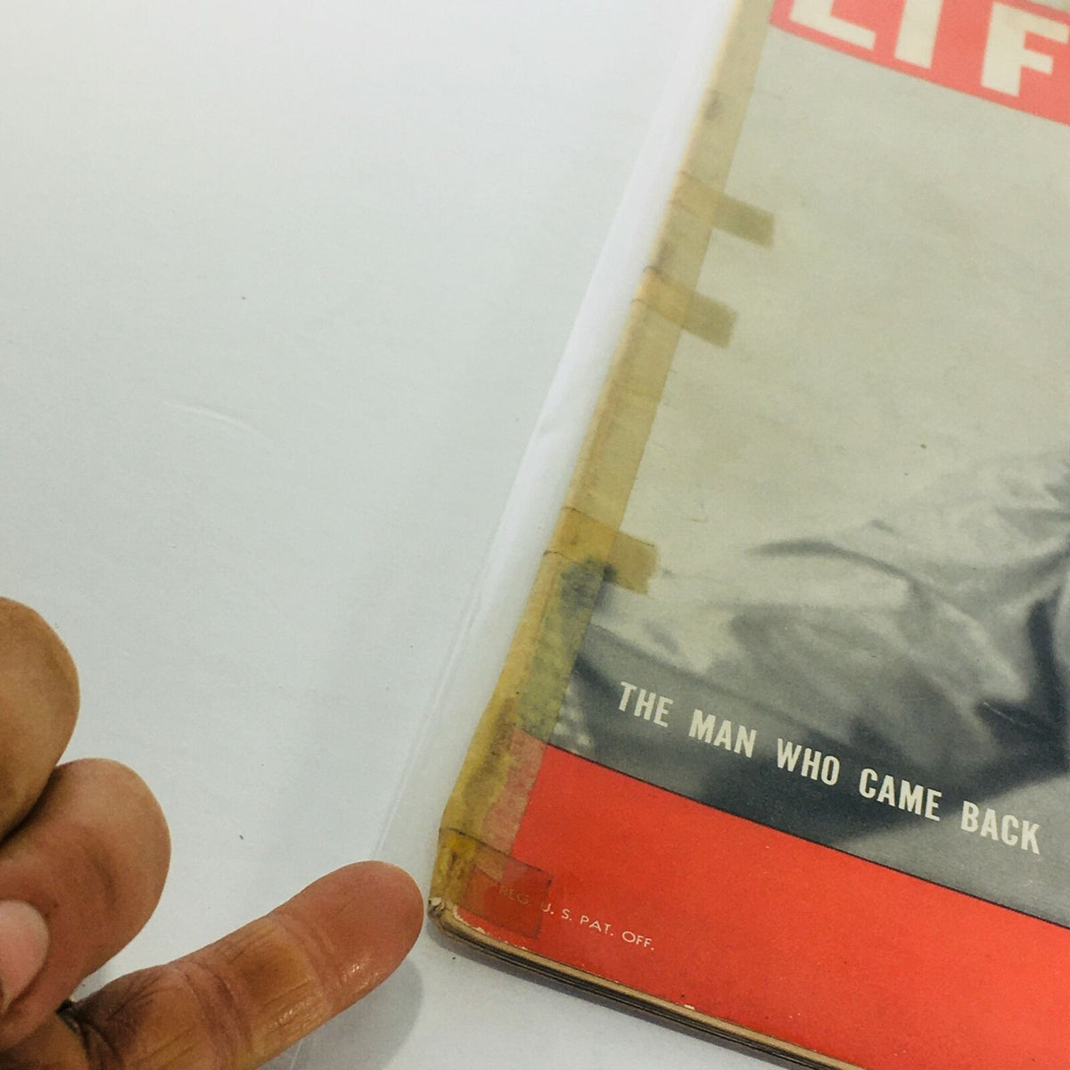Vintage Life Magazine from June 20, 1938 featuring 'The Man Who Came Back' with visible wear and taped binding, captured for historical display.