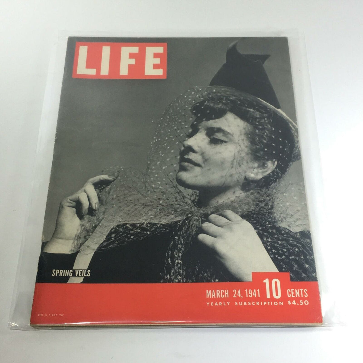 Vintage Life Magazine Cover: March 24, 1941 - Spring Veils showcasing a model wearing a fashionable veil. This issue features vintage fashion highlights from the 1940s.