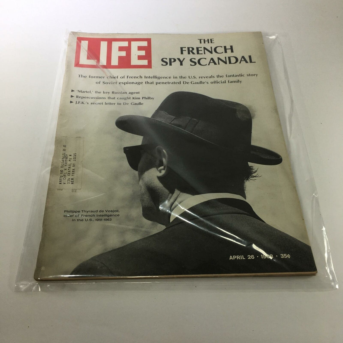 Vintage Life Magazine from April 26, 1968 featuring an article on the French Spy Scandal. The cover showcases a man in a black hat and sunglasses, symbolizing espionage, with the title prominently displayed. A collectible item highlighting historical events relevant to Philippe Thyraud de Vosjoll.