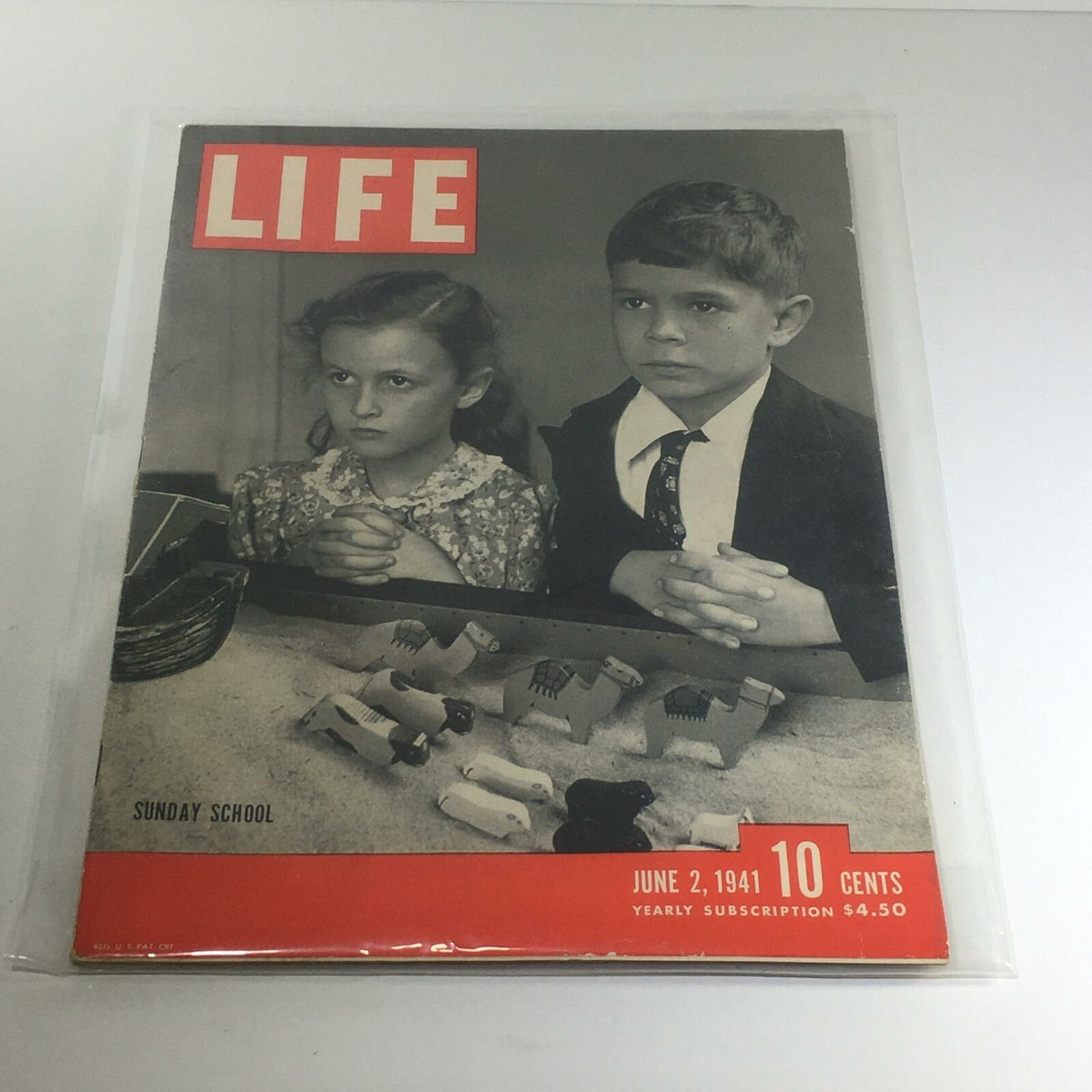 Vintage Life Magazine: June 2, 1941 - Sunday School, featuring two children with folded hands in prayer, surrounded by small animal figurines on a table, showcasing the magazine's historical cover design.