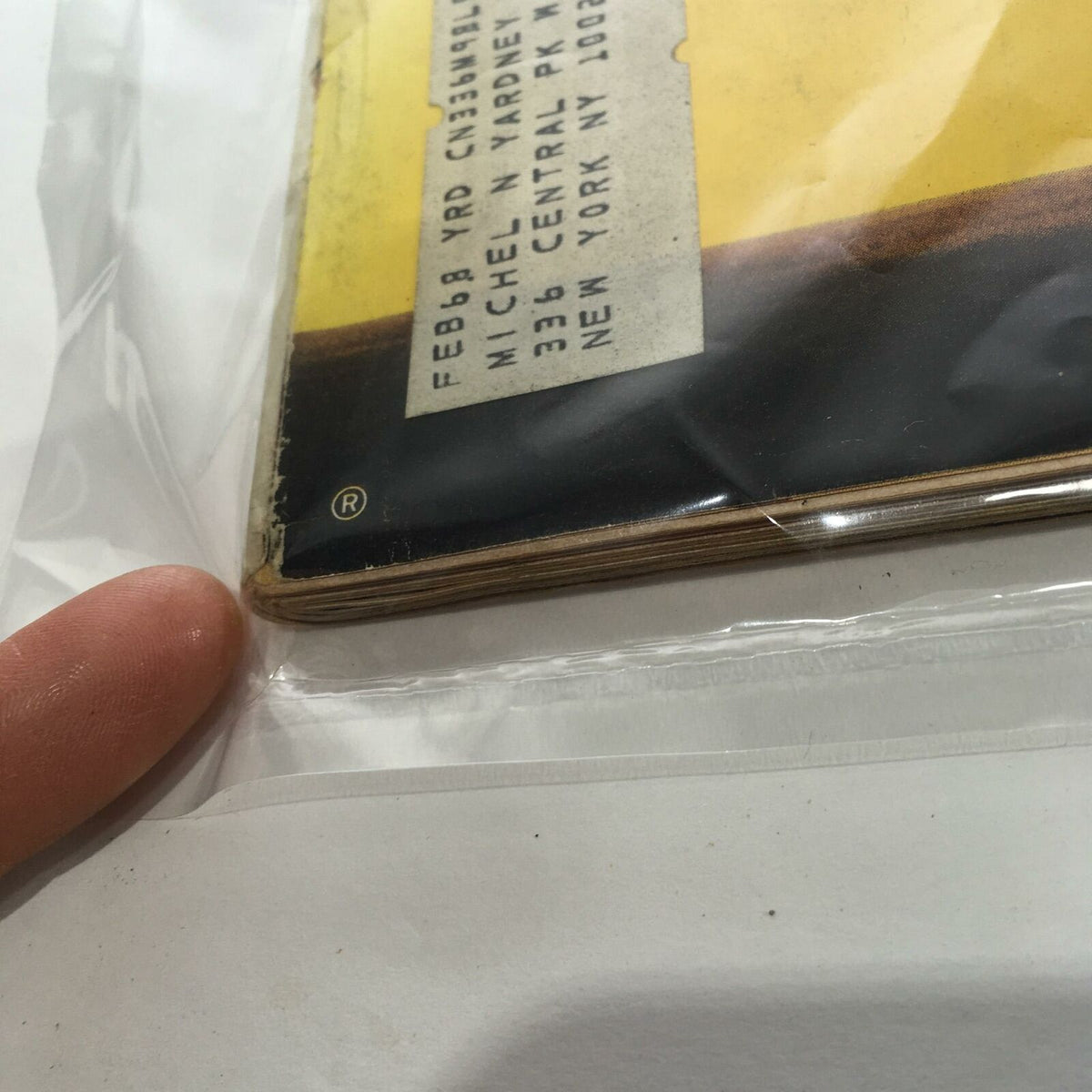 Close-up image of a vintage Life Magazine from December 9, 1966, featuring visible wear on the edges and a protective plastic covering. The magazine's back shows an address label, reflecting its historical significance and condition, related to the issue discussing the draft: 'Who Beats It and How?'.