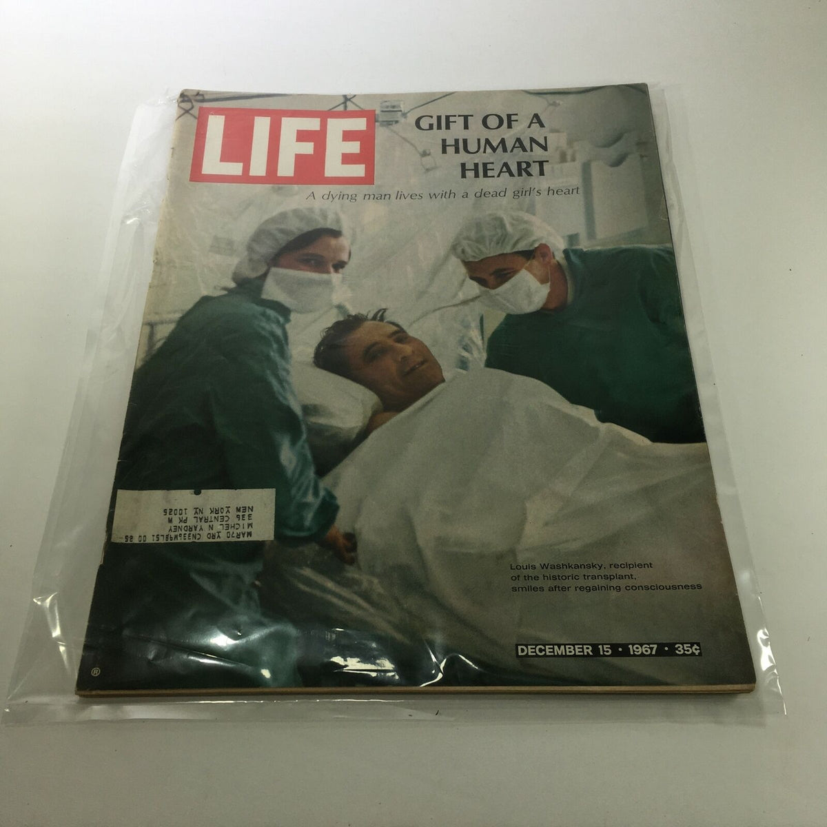 Cover of Life Magazine dated December 15, 1967, featuring the headline 'Gift of a Human Heart'. The image depicts a medical setting with two doctors assisting the recipient of a heart transplant, Louis Washkansky, who is in a hospital bed. This edition showcases the significant medical advancement of heart transplantation.