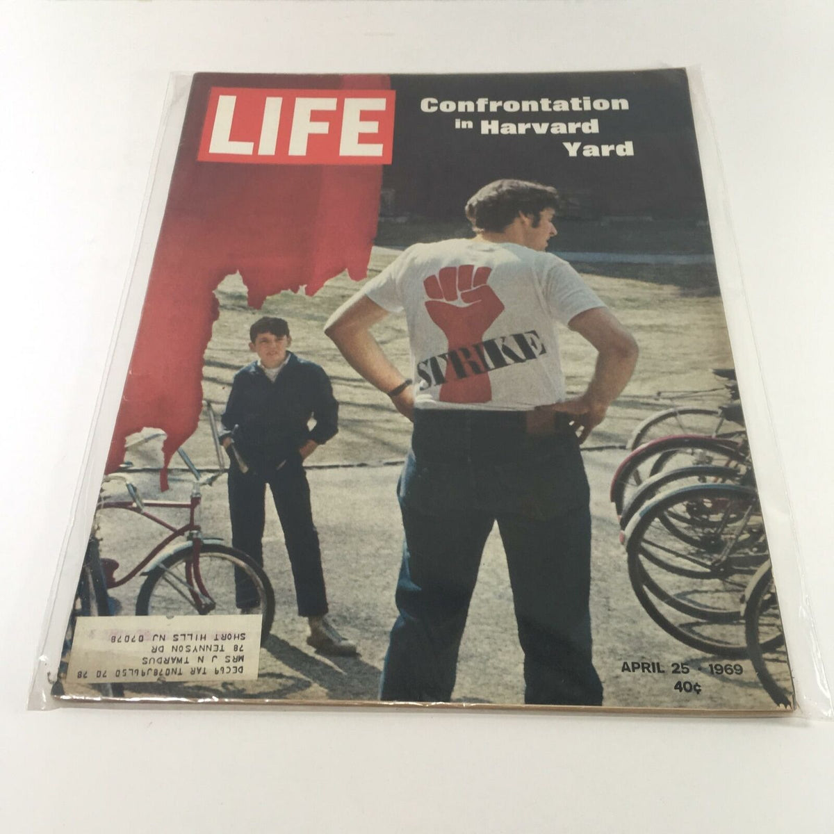 VTG Life Magazine April 25 1969 cover featuring a scene from Harvard Yard during protests, showcasing a student wearing a 'STRIKE' t-shirt and another student in the background. This historic issue includes articles on General Creighton Abrams and the Harvard riots.