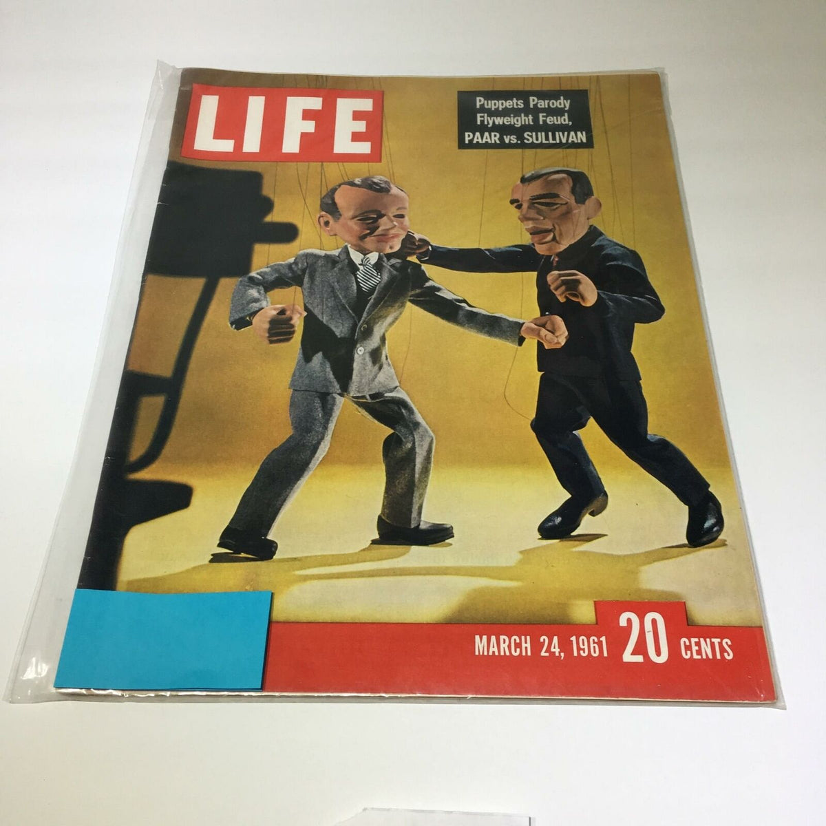 Vintage Life Magazine March 24, 1961 featuring an illustration of puppets parodying the rivalry between Jack Paar and Ed Sullivan, showcasing a humorous scene on the cover.