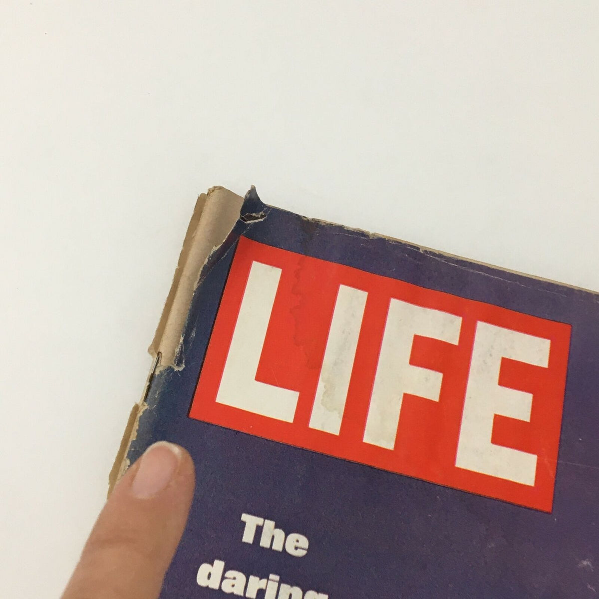 Close-up of the upper section of the VTG Life Magazine March 14 1969 cover displaying the title and worn edges.