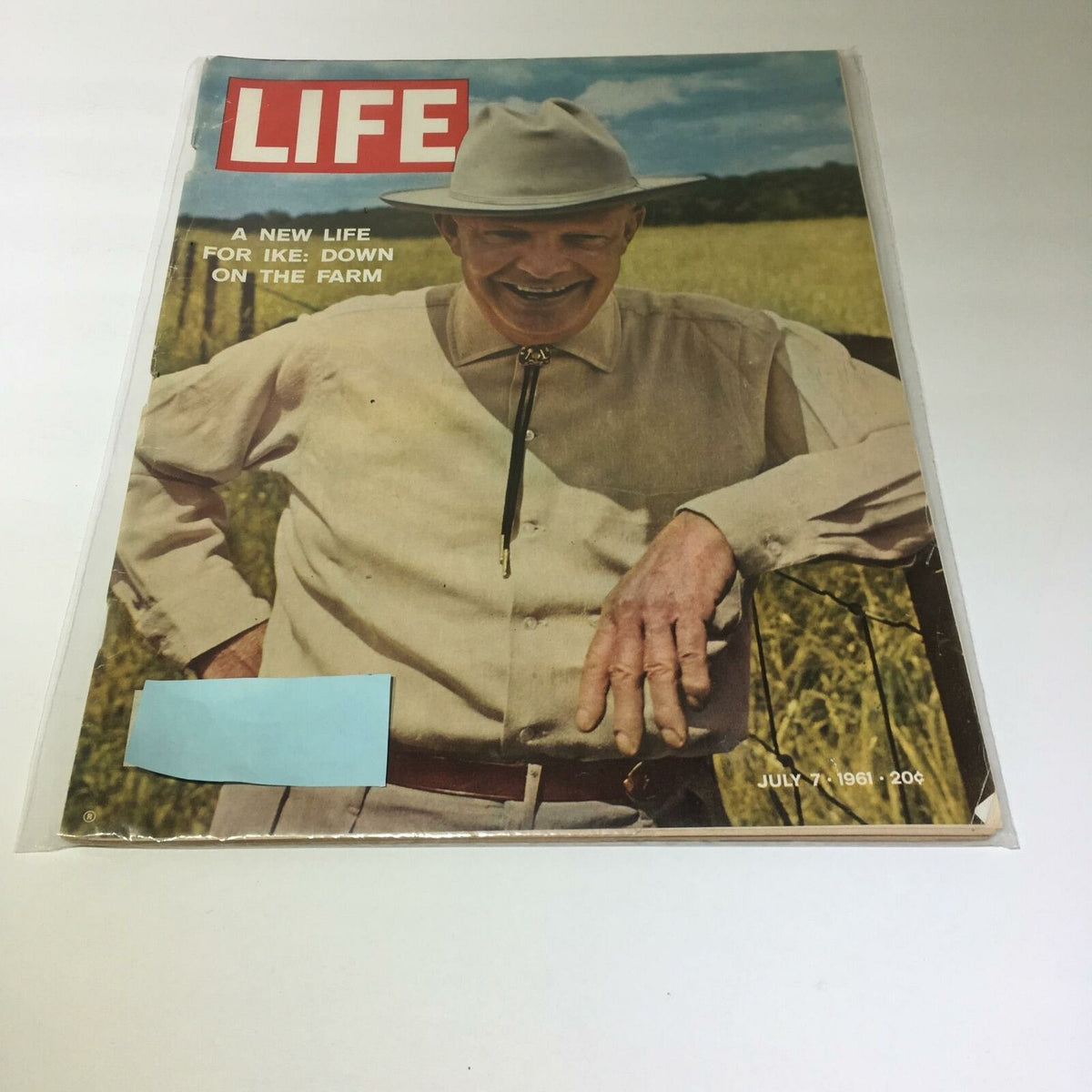 Vintage Life Magazine cover from July 7, 1961 featuring the title 'A New Life For Ike: Down On The Farm', showcasing a smiling man in a hat, posing in a field, with nostalgic imagery reflecting an era of American history.
