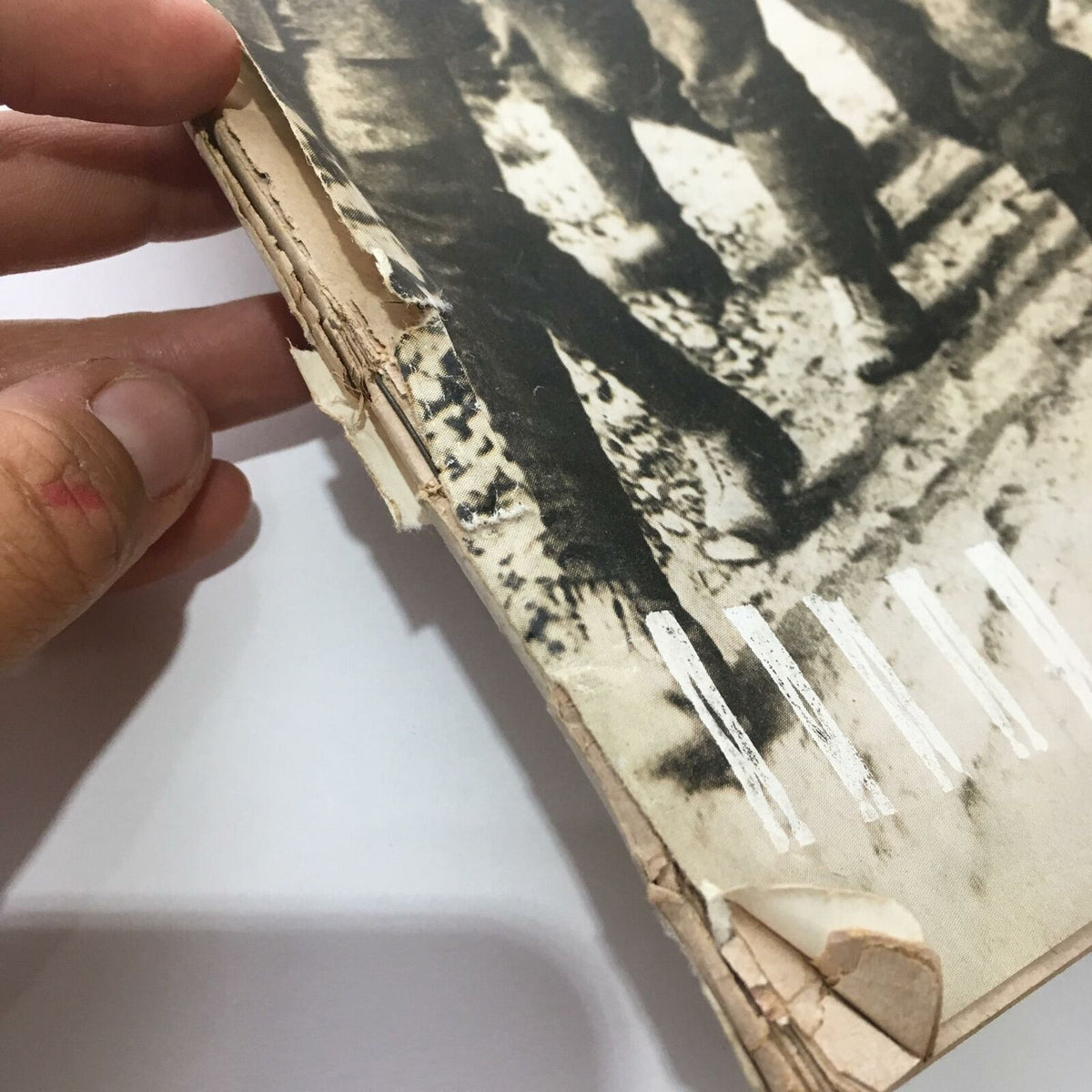 Detail of the spine and edge wear on the Vintage Life Magazine dated March 13, 1964, titled 'The First Word War', showcasing its vintage condition.