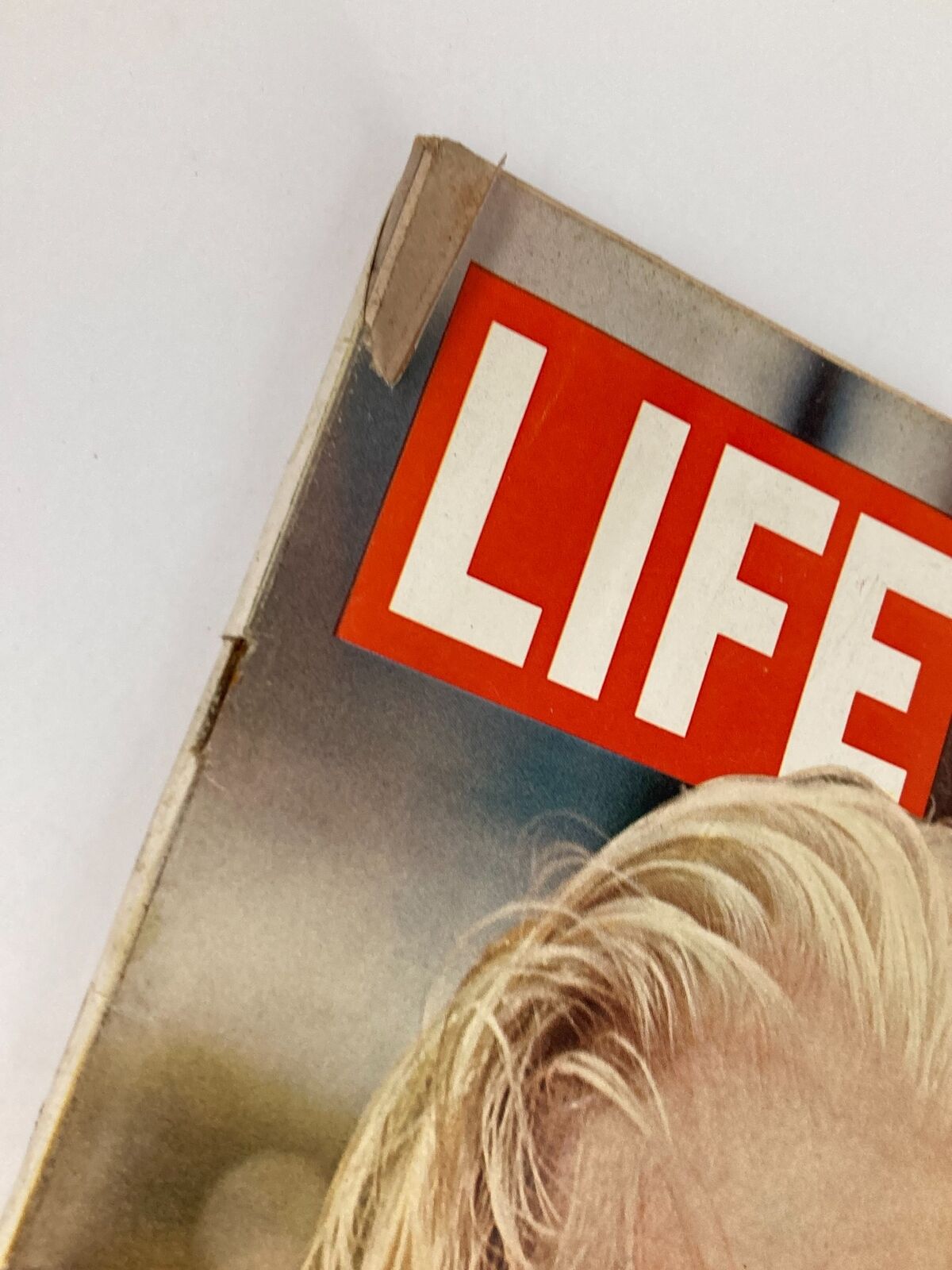 Close-up of the corner of the VTG Life Magazine from February 19, 1965, featuring the title prominently displayed. This vintage magazine showcases Dr. Schweitzer, 'The Great White Wizard at 90.'
