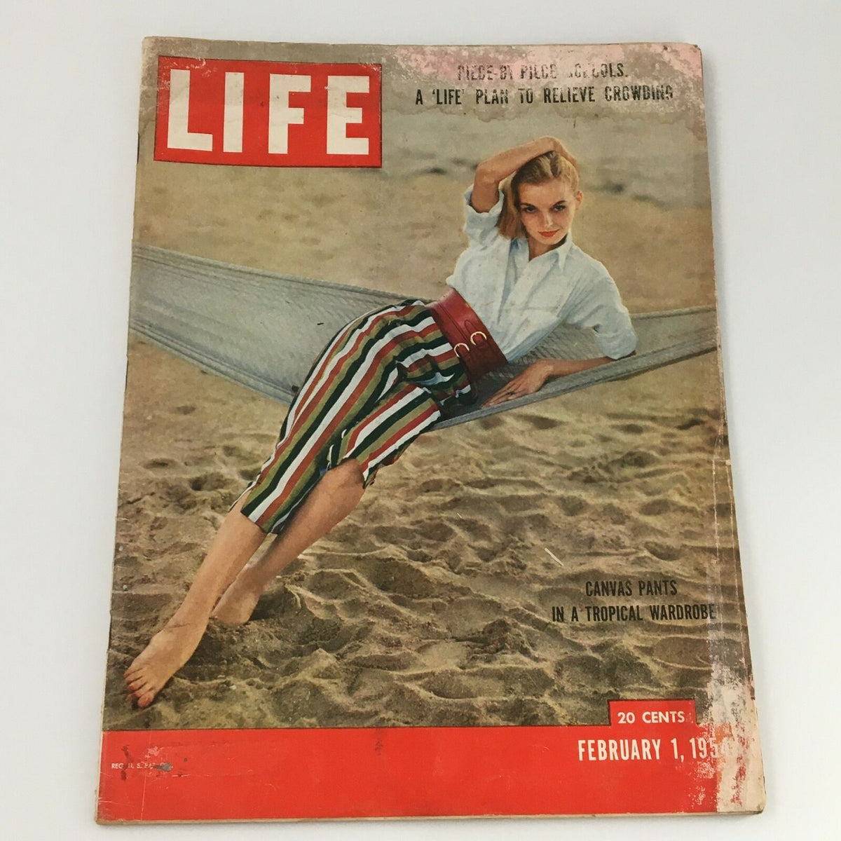 Cover of VTG Life Magazine February 1 1954 featuring a woman in a hammock, wearing a white shirt and striped pants, with the title 'A Life Plan To Relieve Crowding.'