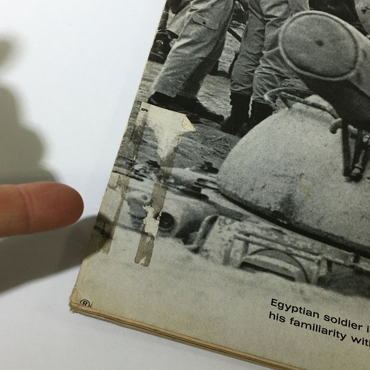 Close-up view of the edge of the VTG Life Magazine November 29, 1968, showing minor wear and a peel on the cover, highlighting its vintage condition and historical significance.