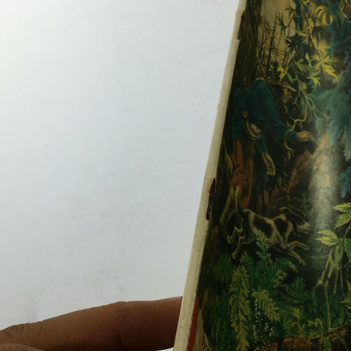 Finger pointing at the side of the VTG Life Magazine August 31 1959, illustrating the magazine's age and wear with a close-up of its illustrated cover.