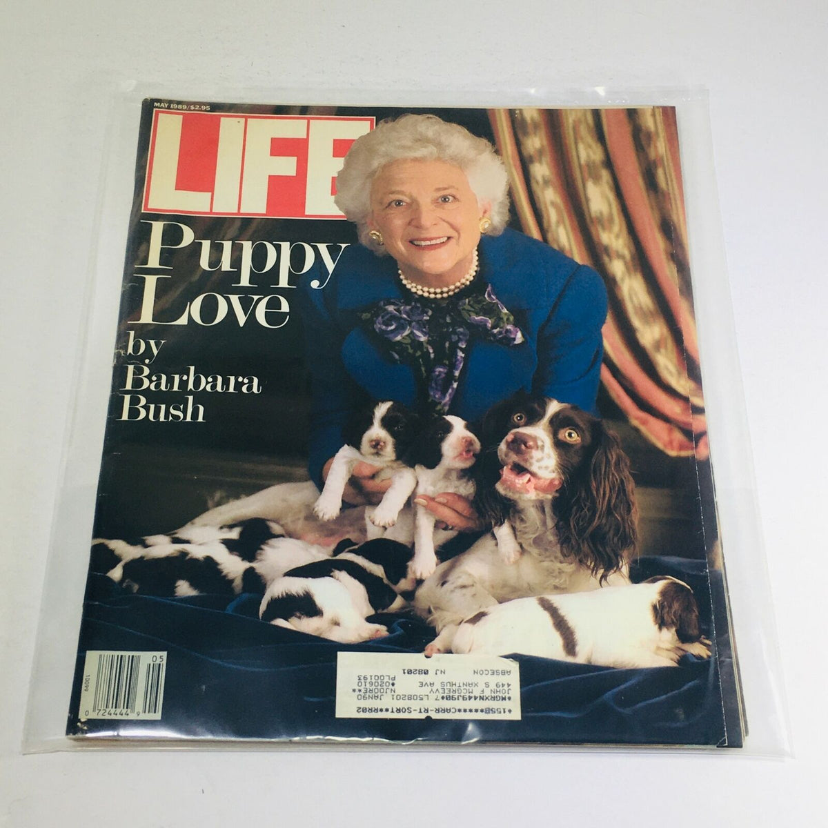VTG Life Magazine from May 1989 featuring 'Puppy Love' by Barbara Bush on the cover, showcasing her joyfully surrounded by adorable puppies.