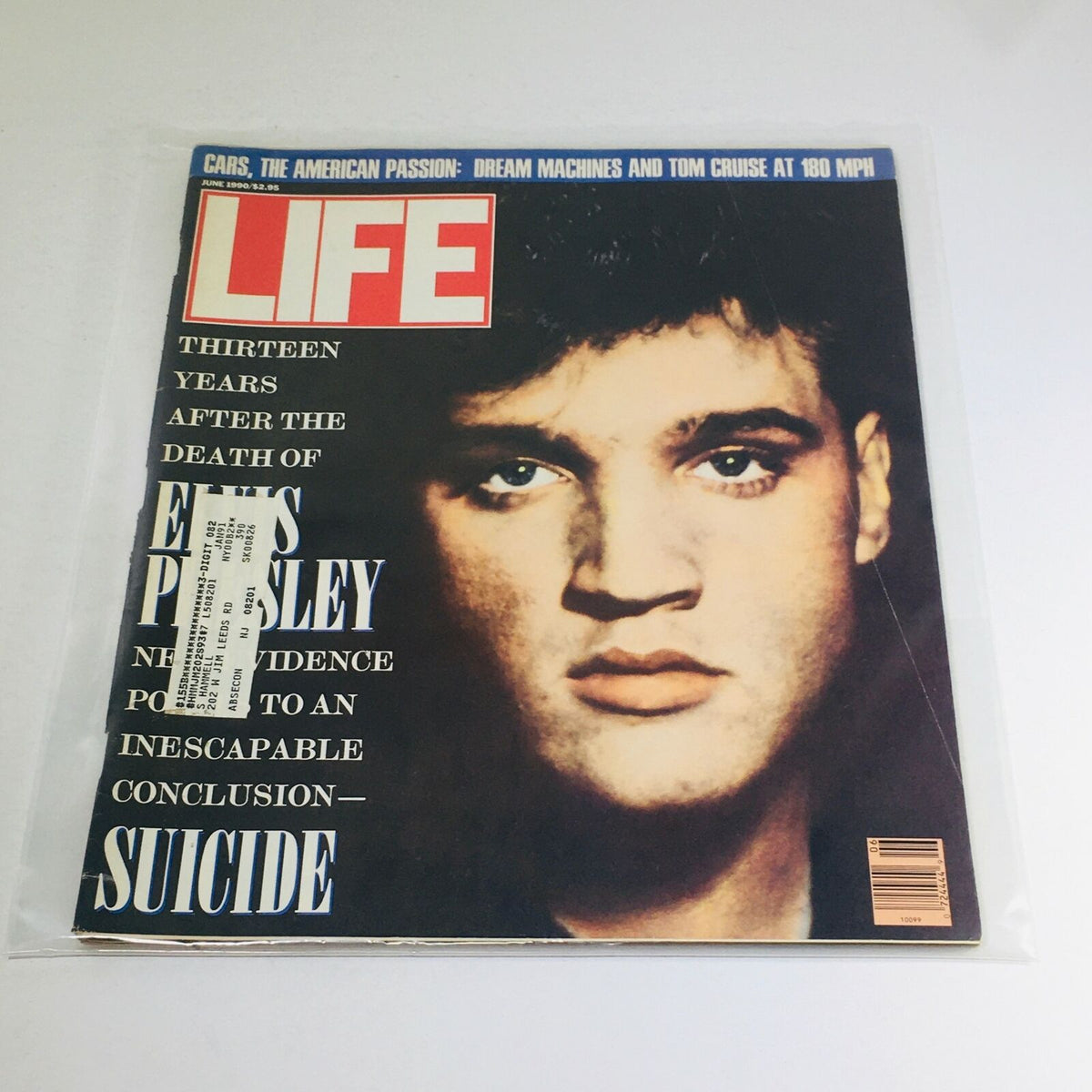 Vintage June 1990 Life Magazine cover featuring a portrait of Elvis Presley, commemorating 13 years after his death, along with a mention of Tom Cruise, highlighting this collectible issue's historical significance.