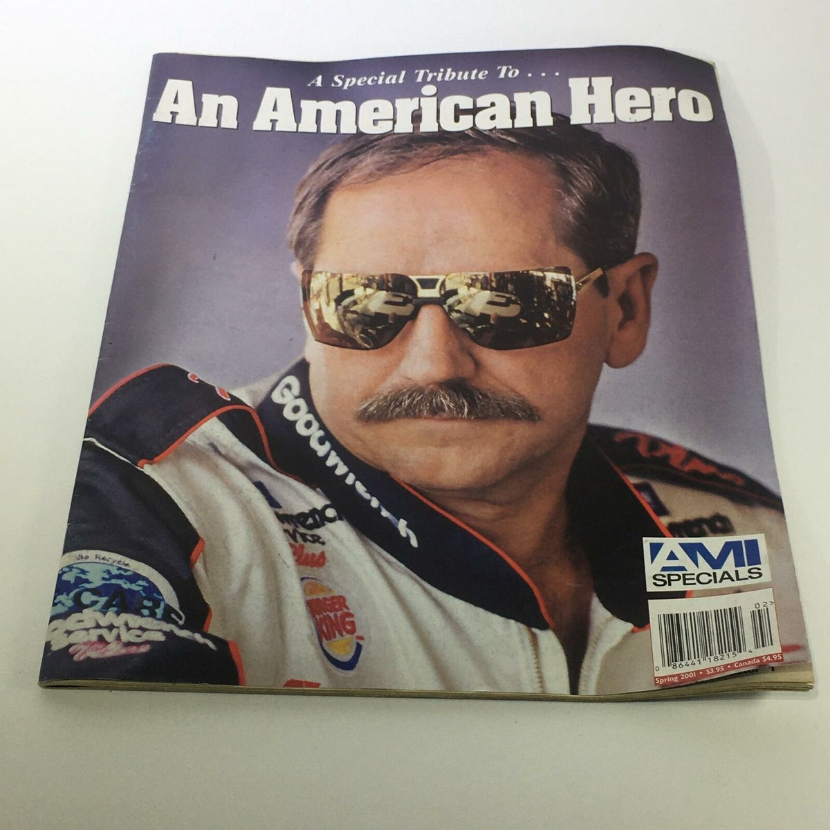 AMI Specials A Tribute to an American Hero Dale Earnhardt Magazine cover featuring a man with sunglasses, showcasing the theme of tribute to an American hero.