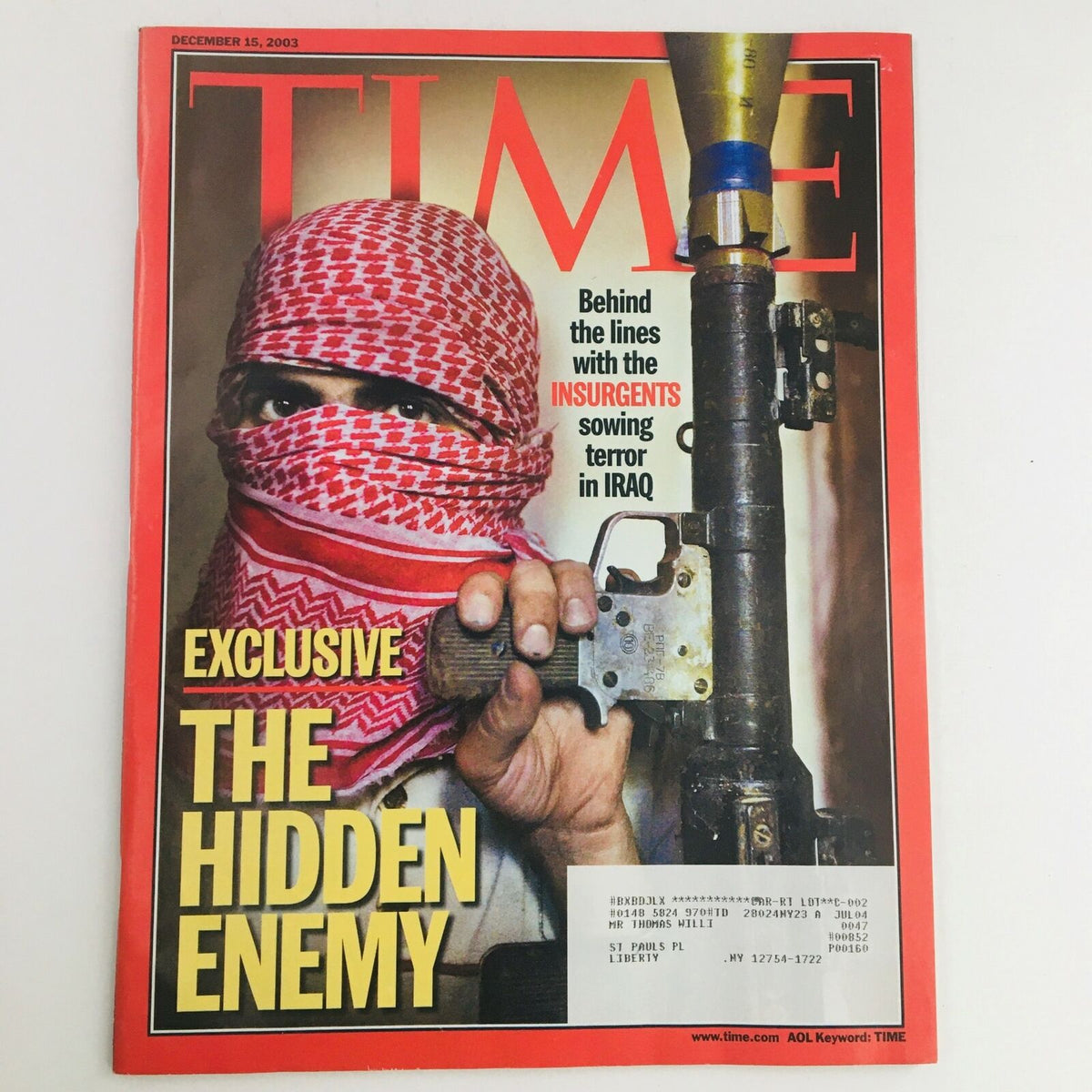 Time Magazine December 15 2003 cover featuring the story 'The Hidden Enemy & Insurgents: Terror in Iraq', highlighting a masked individual with a rifle, representing wartime tensions in Iraq.