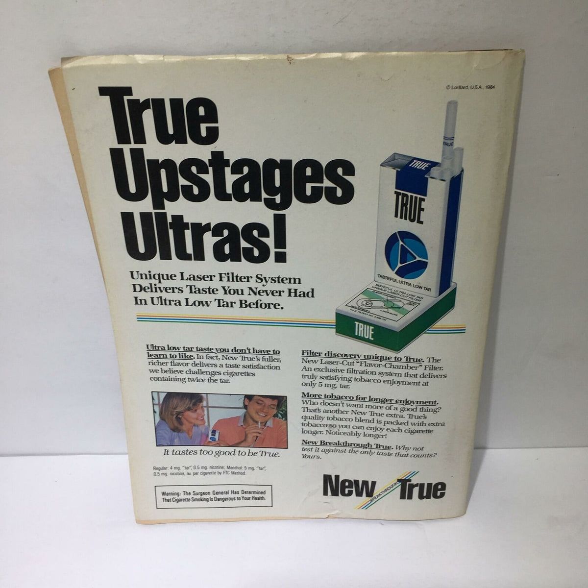 Advert from the inside back cover of the Time Magazine October 1, 1984, featuring the promotional message 'True Upstages Ultras!' with details about the unique laser filter system for cigarettes.