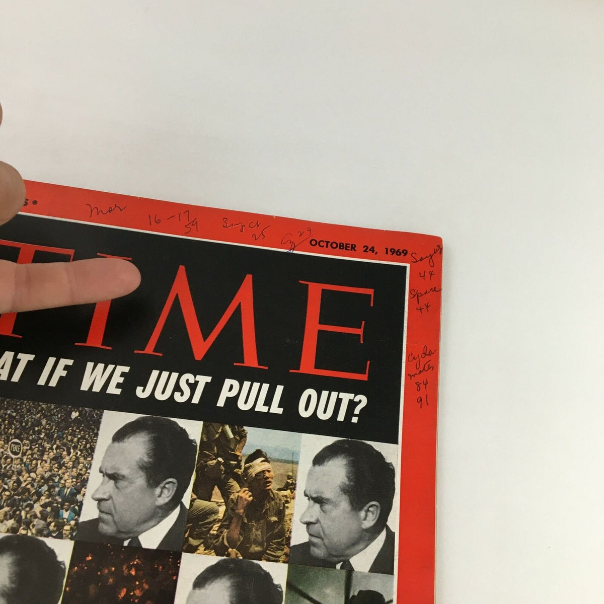 Another close-up perspective of the Time Magazine cover dated October 24, 1969, with Richard Nixon and the provocative question 'What if We Just Pull Out?', showing detailed inscriptions and wear typical of a vintage magazine.